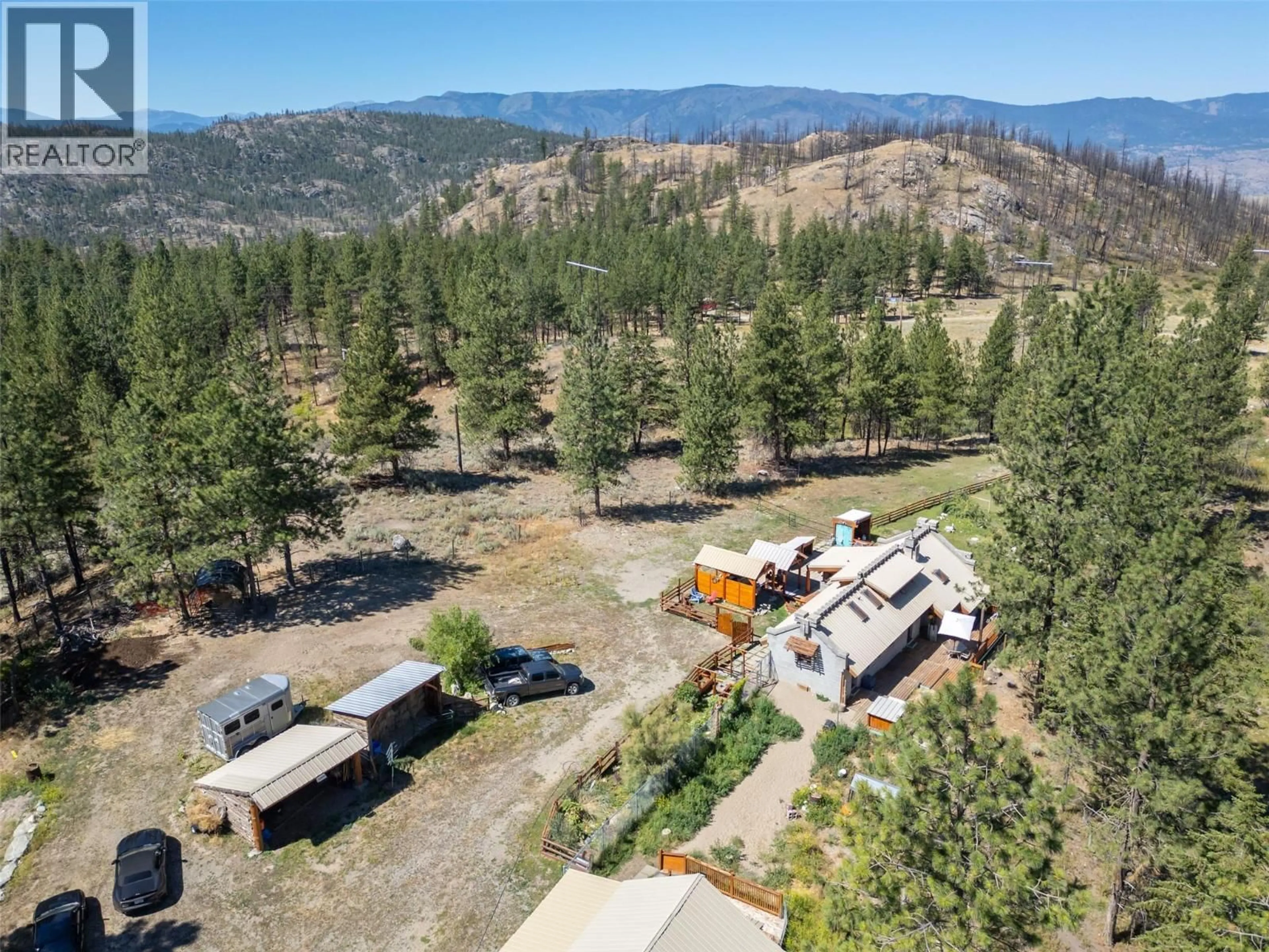 A pic from outside/outdoor area/front of a property/back of a property/a pic from drone, forest/trees view for 156 PORCUPINE PLACE, Oliver British Columbia V0H1T8