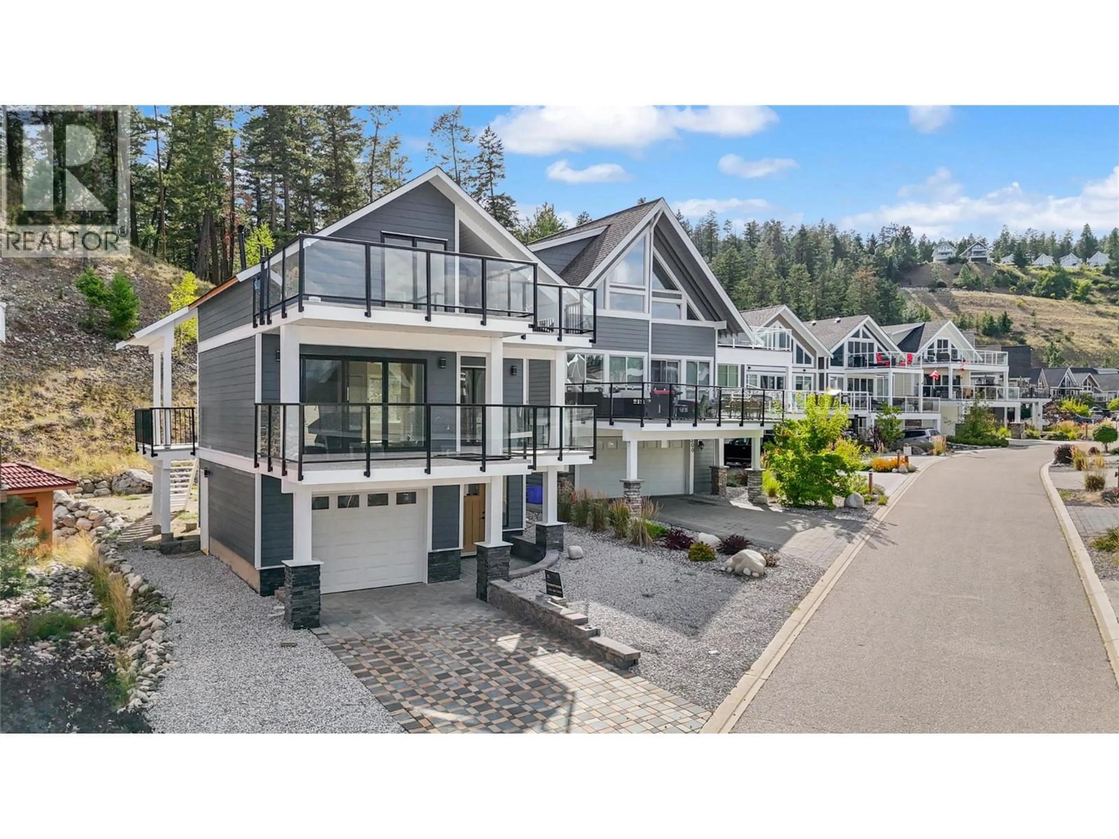 A pic from outside/outdoor area/front of a property/back of a property/a pic from drone, mountain view for 6736 MARBELLA LOOP, Kelowna British Columbia V0E1S0