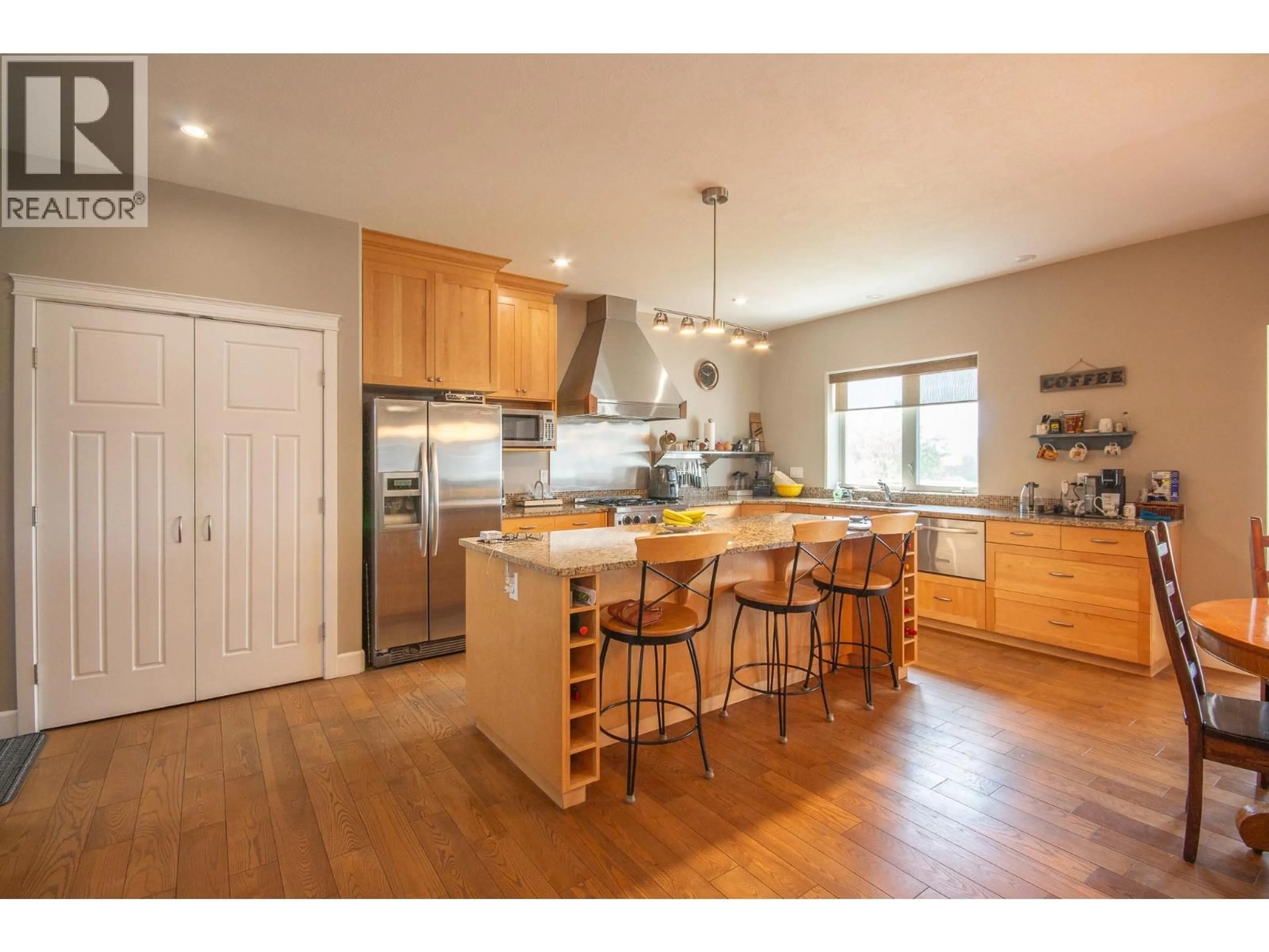 Open concept kitchen, wood/laminate floor for 408 BRIAR RIDGE ROAD, Pouce Coupe British Columbia V0C2C0