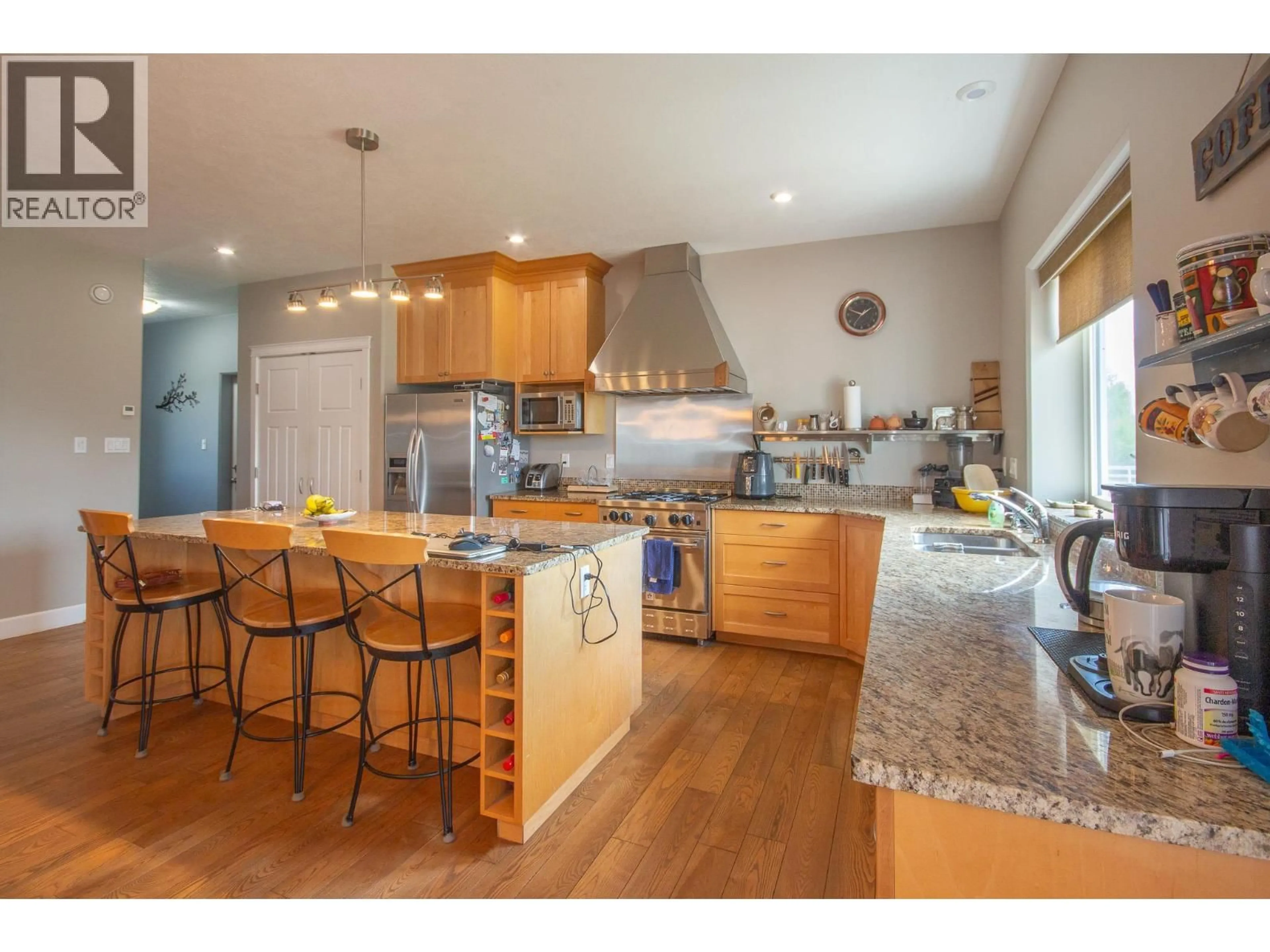 Open concept kitchen, wood/laminate floor for 408 BRIAR RIDGE ROAD, Pouce Coupe British Columbia V0C2C0