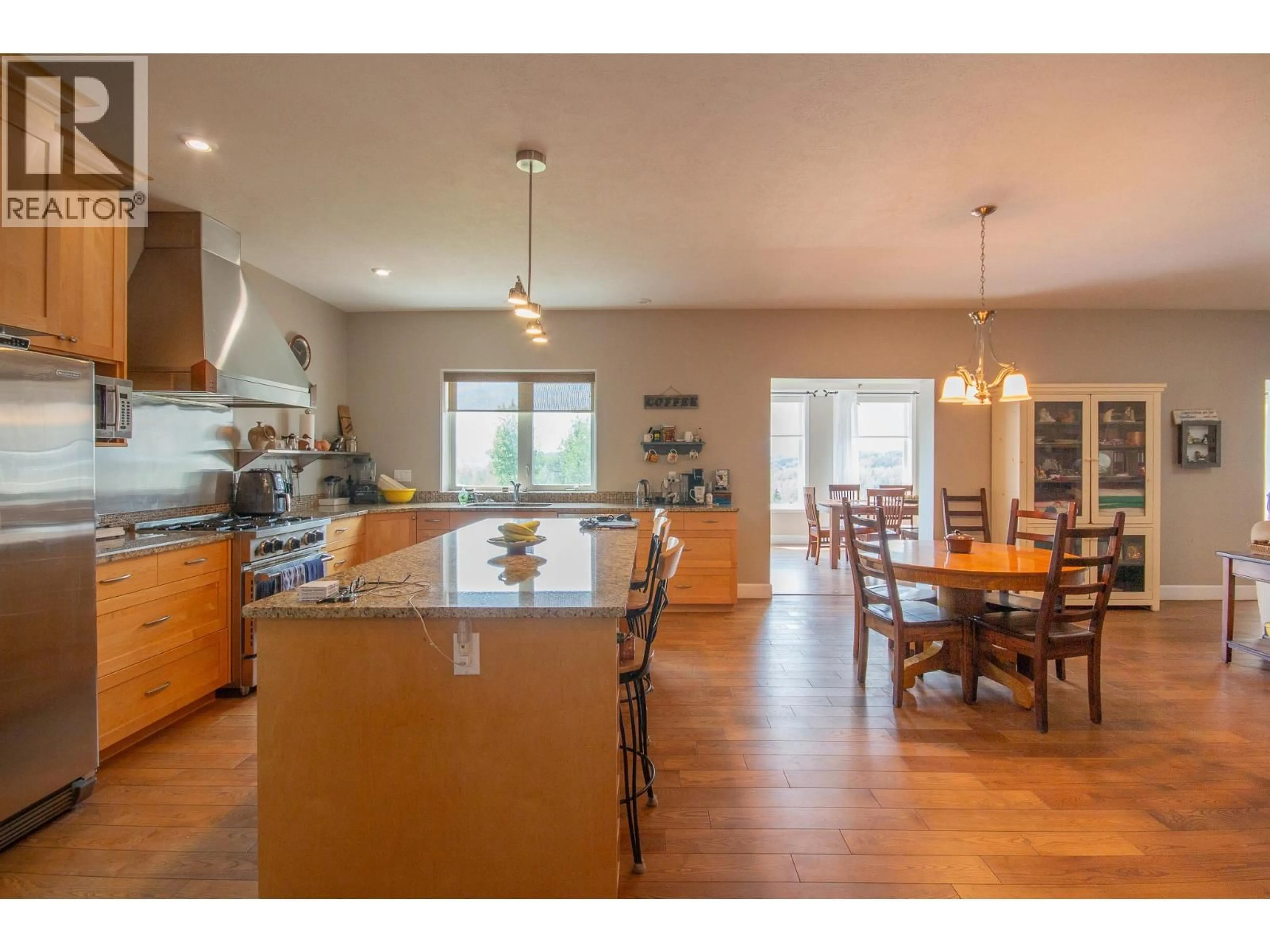 Open concept kitchen, wood/laminate floor for 408 BRIAR RIDGE ROAD, Pouce Coupe British Columbia V0C2C0