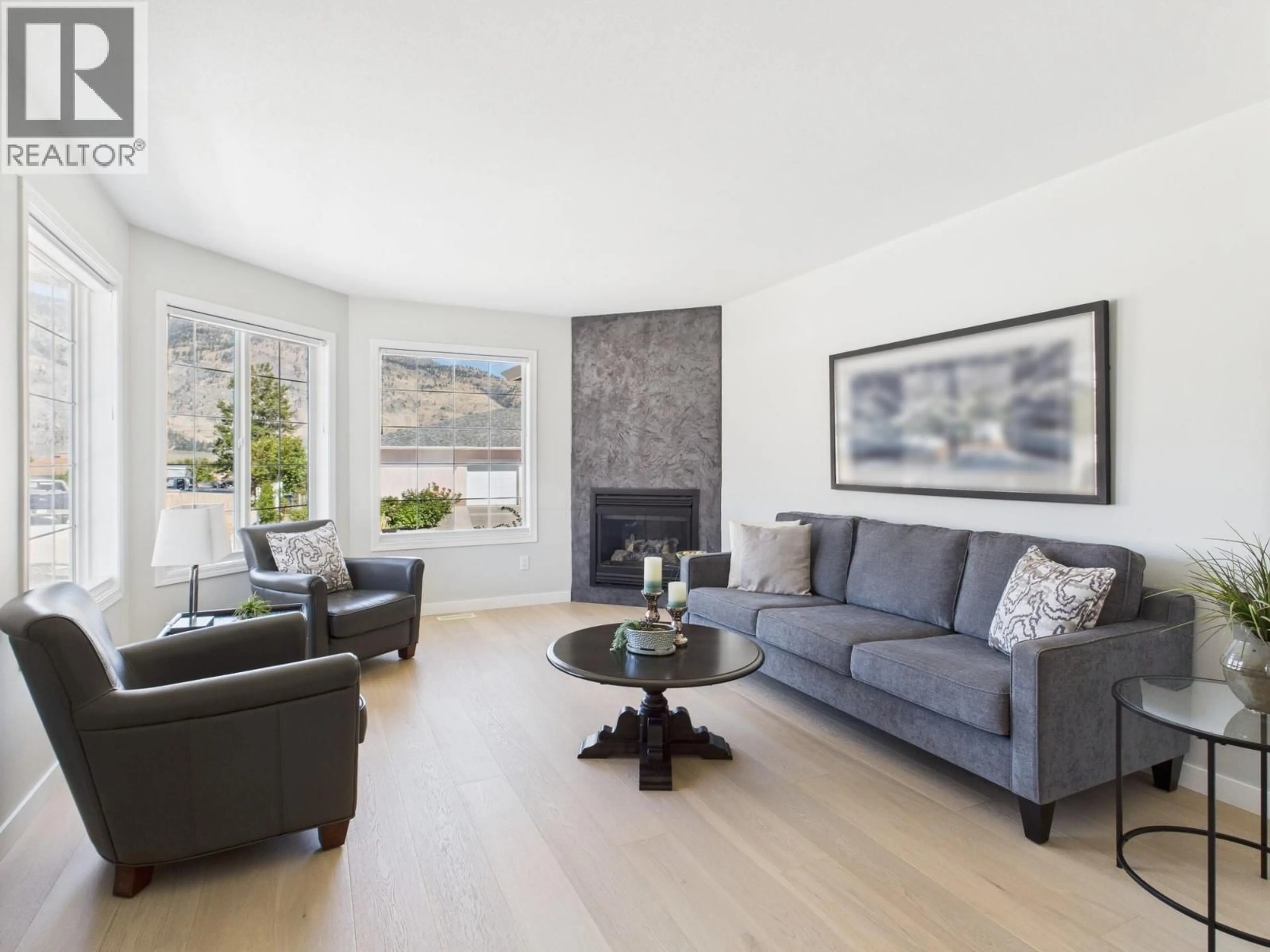 Living room with furniture, wood/laminate floor for 7008 NIGHTHAWK DRIVE, Osoyoos British Columbia V0H1V5