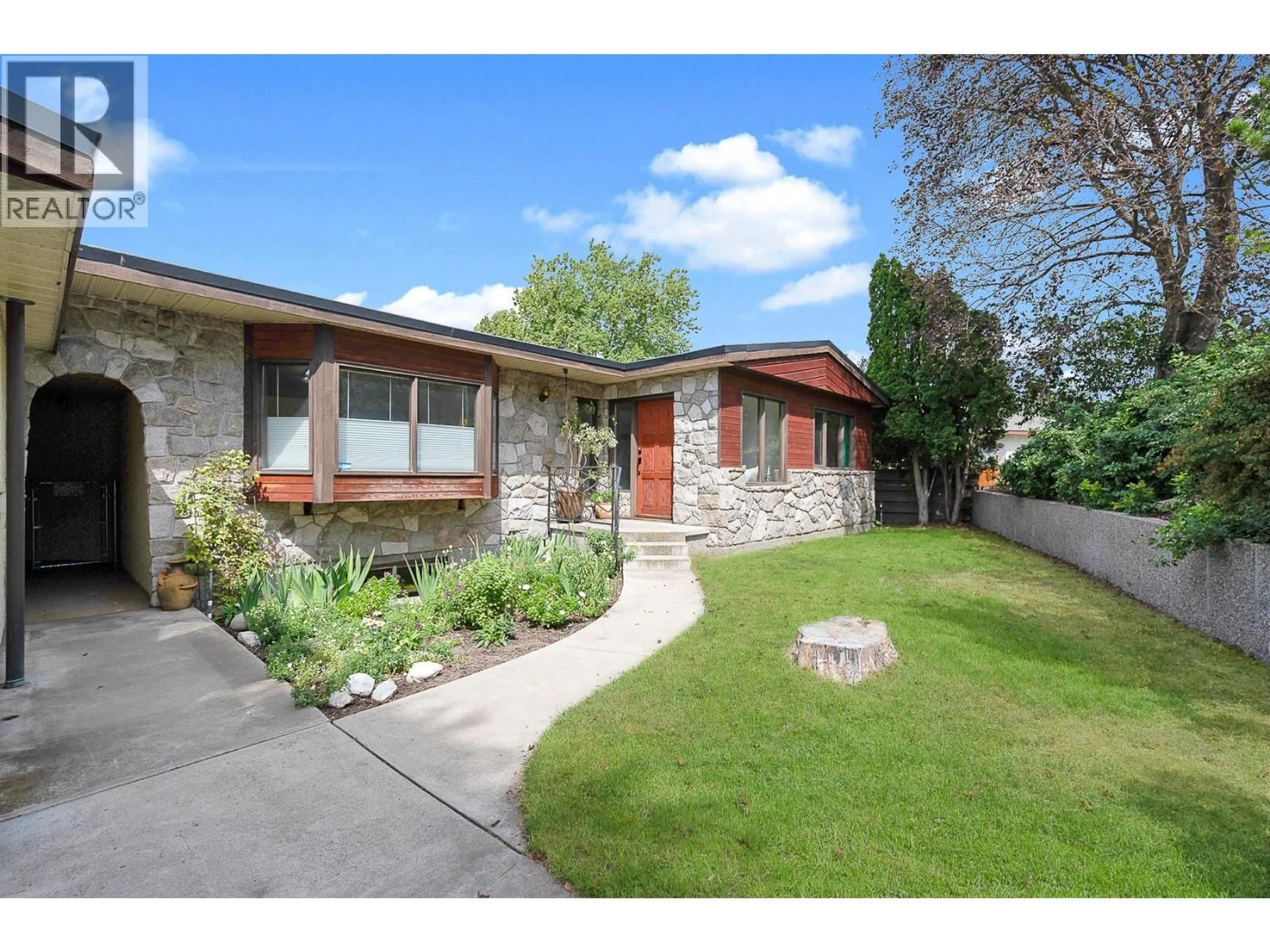 Home with brick exterior material, street for 1590 WILLOW CRESCENT, Kelowna British Columbia V1Y4K3