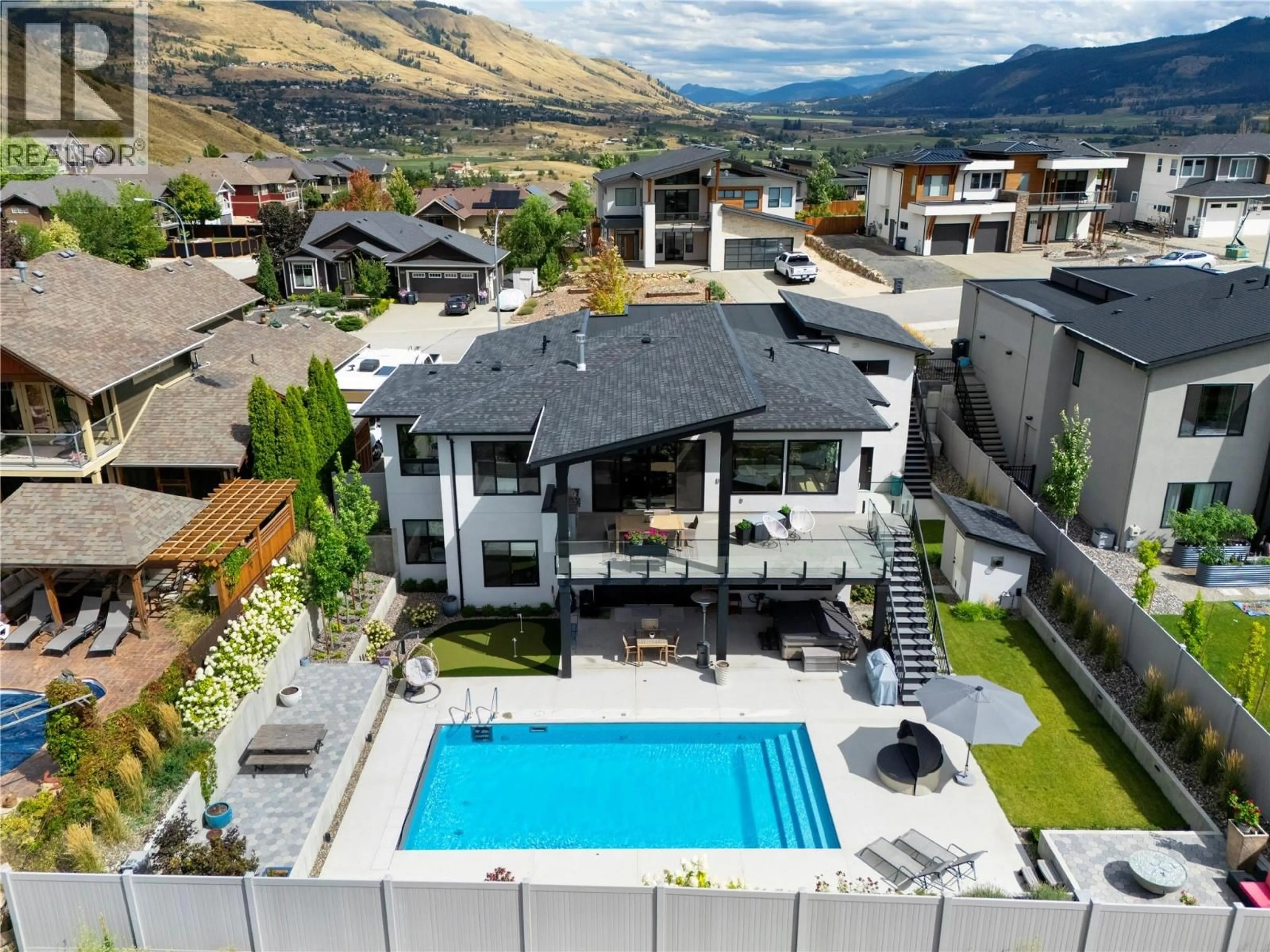 A pic from outside/outdoor area/front of a property/back of a property/a pic from drone, mountain view for 640 MT. IDA CRESCENT, Coldstream British Columbia V1B4G3