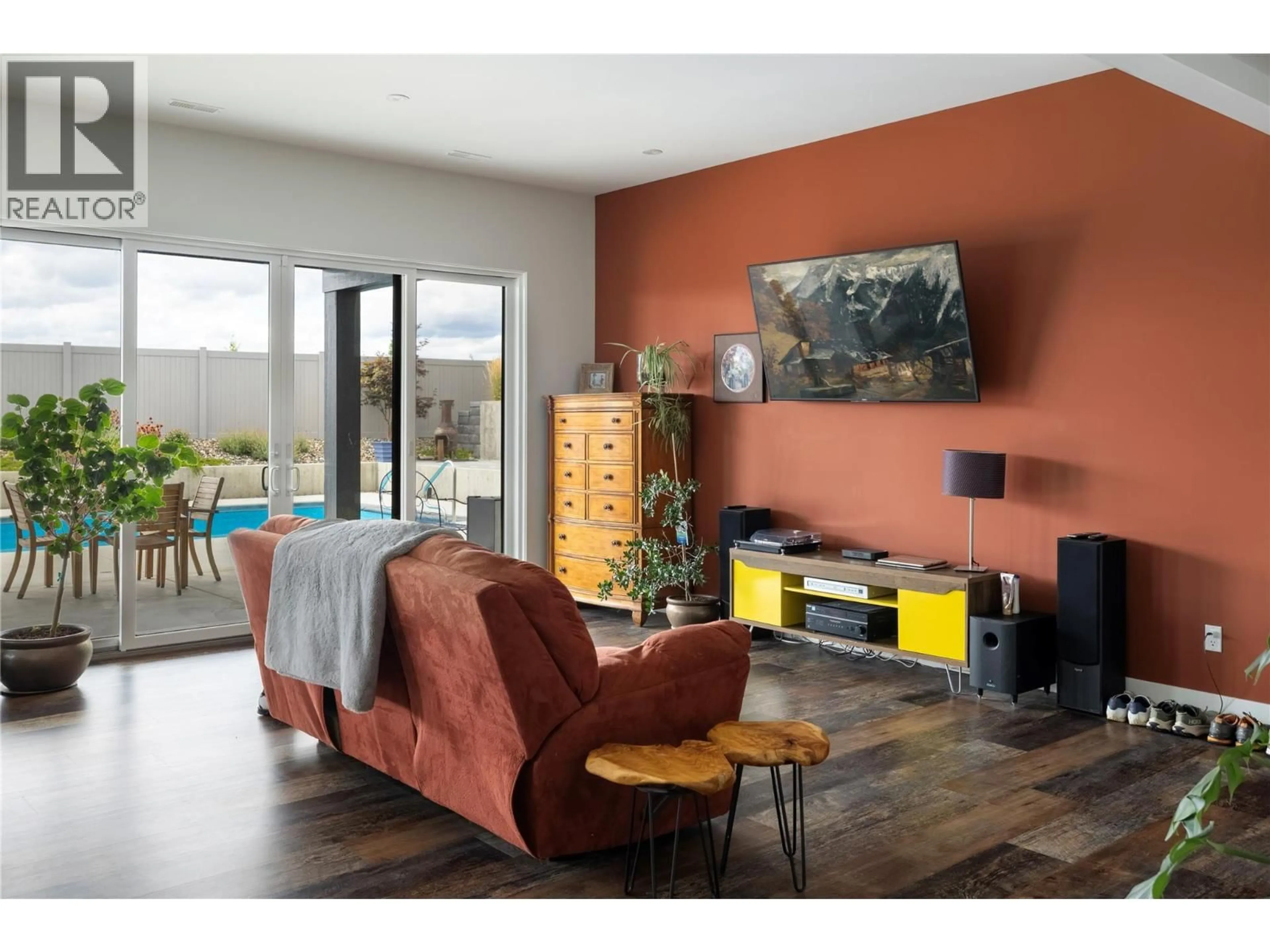 Living room with furniture, wood/laminate floor for 640 MT. IDA CRESCENT, Coldstream British Columbia V1B4G3