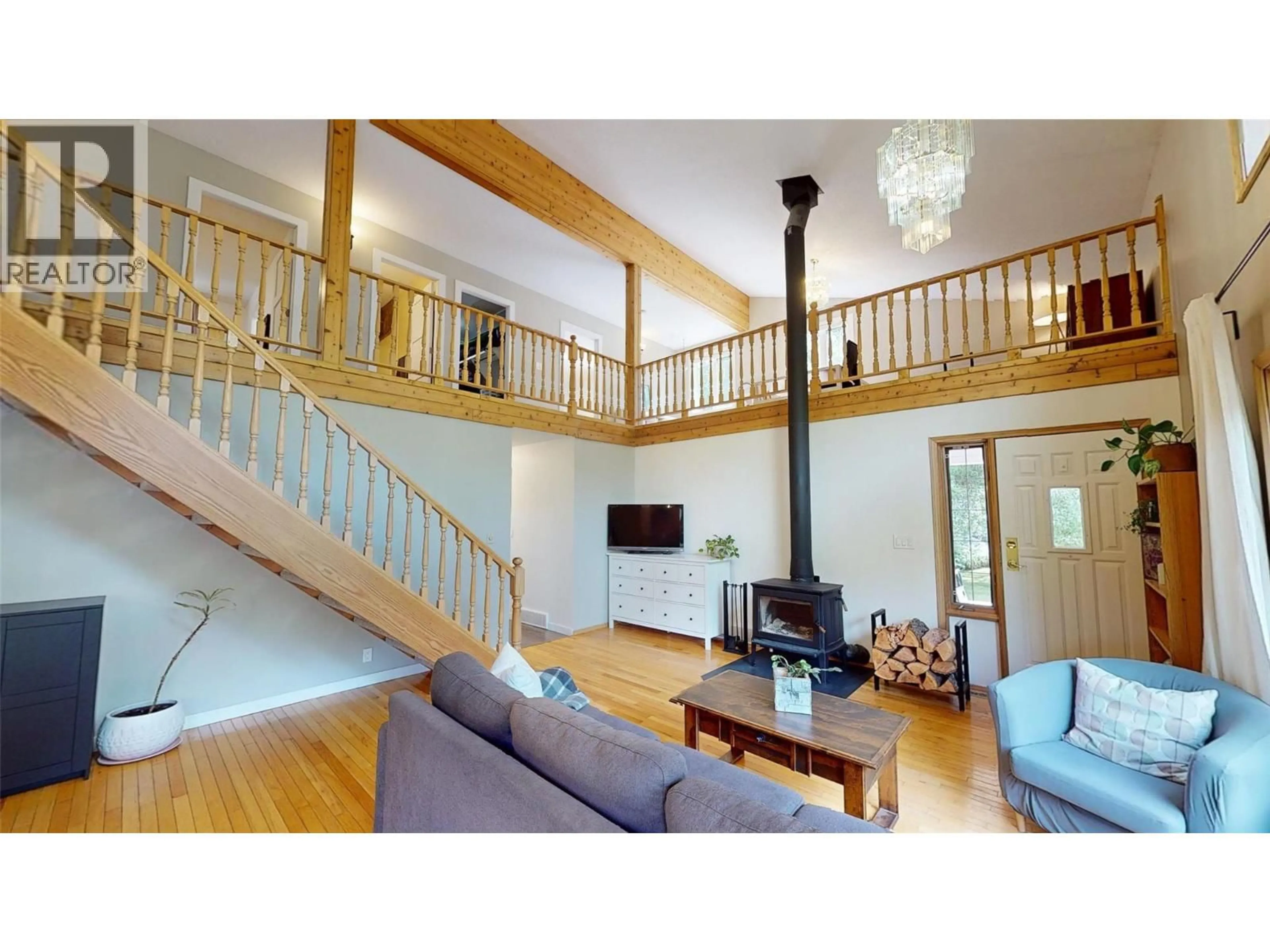 Living room with furniture, wood/laminate floor for 7392 8TH AVENUE, Hosmer British Columbia V0B1M5