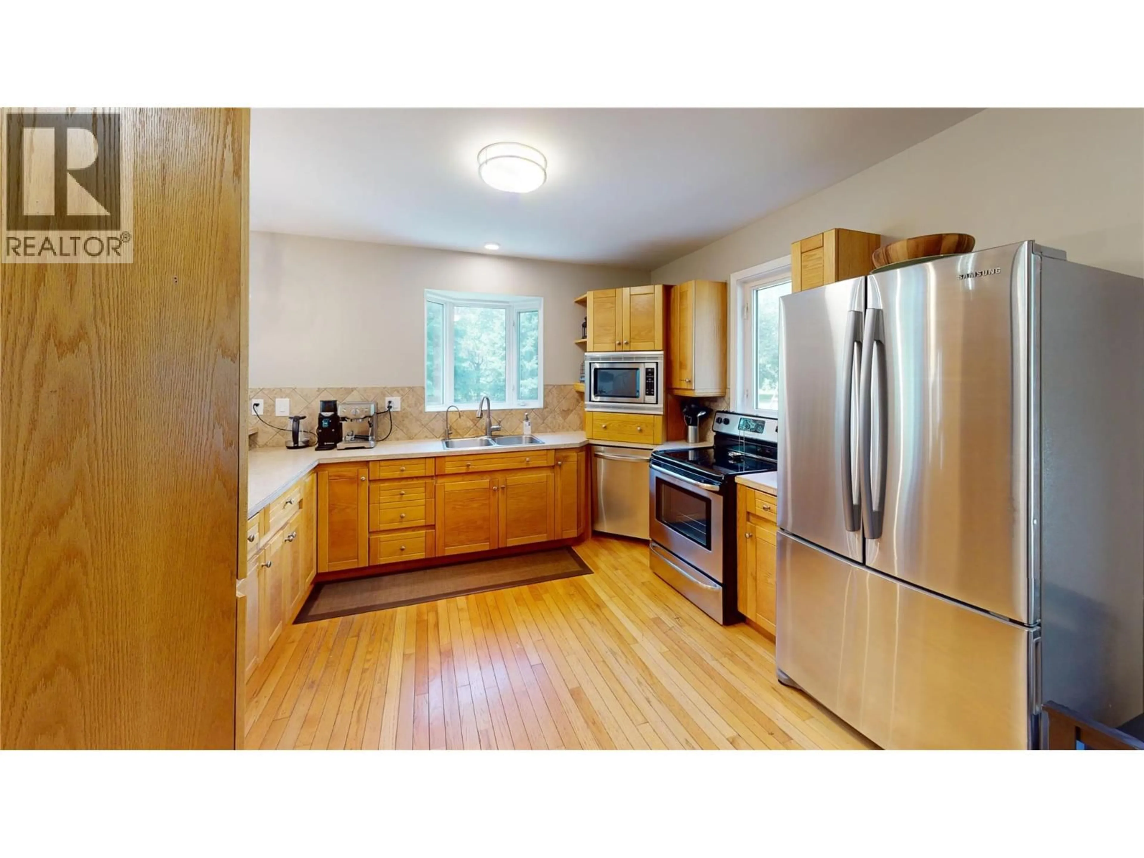 Standard kitchen, wood/laminate floor for 7392 8TH AVENUE, Hosmer British Columbia V0B1M5