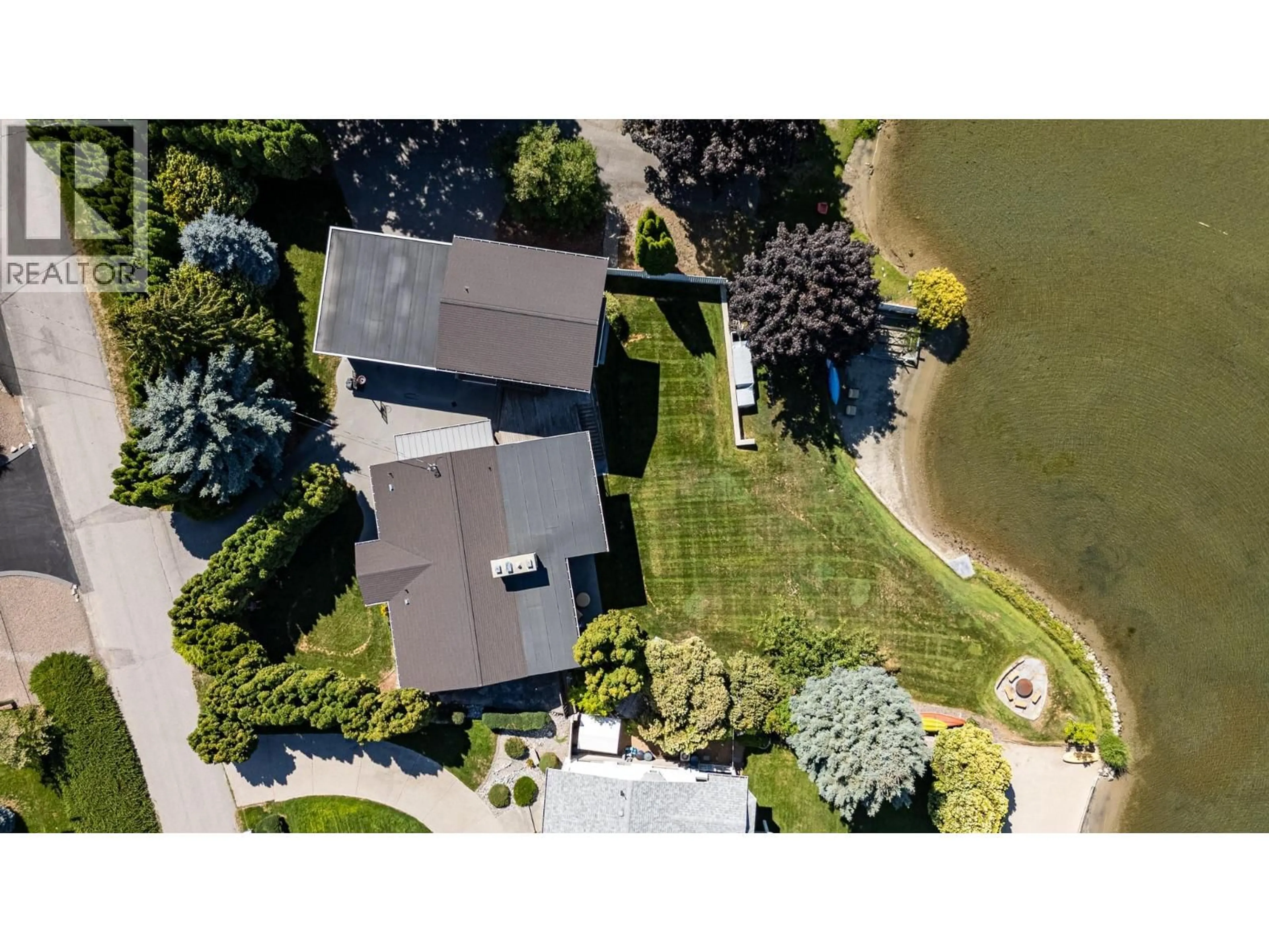 A pic from outside/outdoor area/front of a property/back of a property/a pic from drone, water/lake/river/ocean view for 138 DEVON DRIVE, Okanagan Falls British Columbia V0H1R5