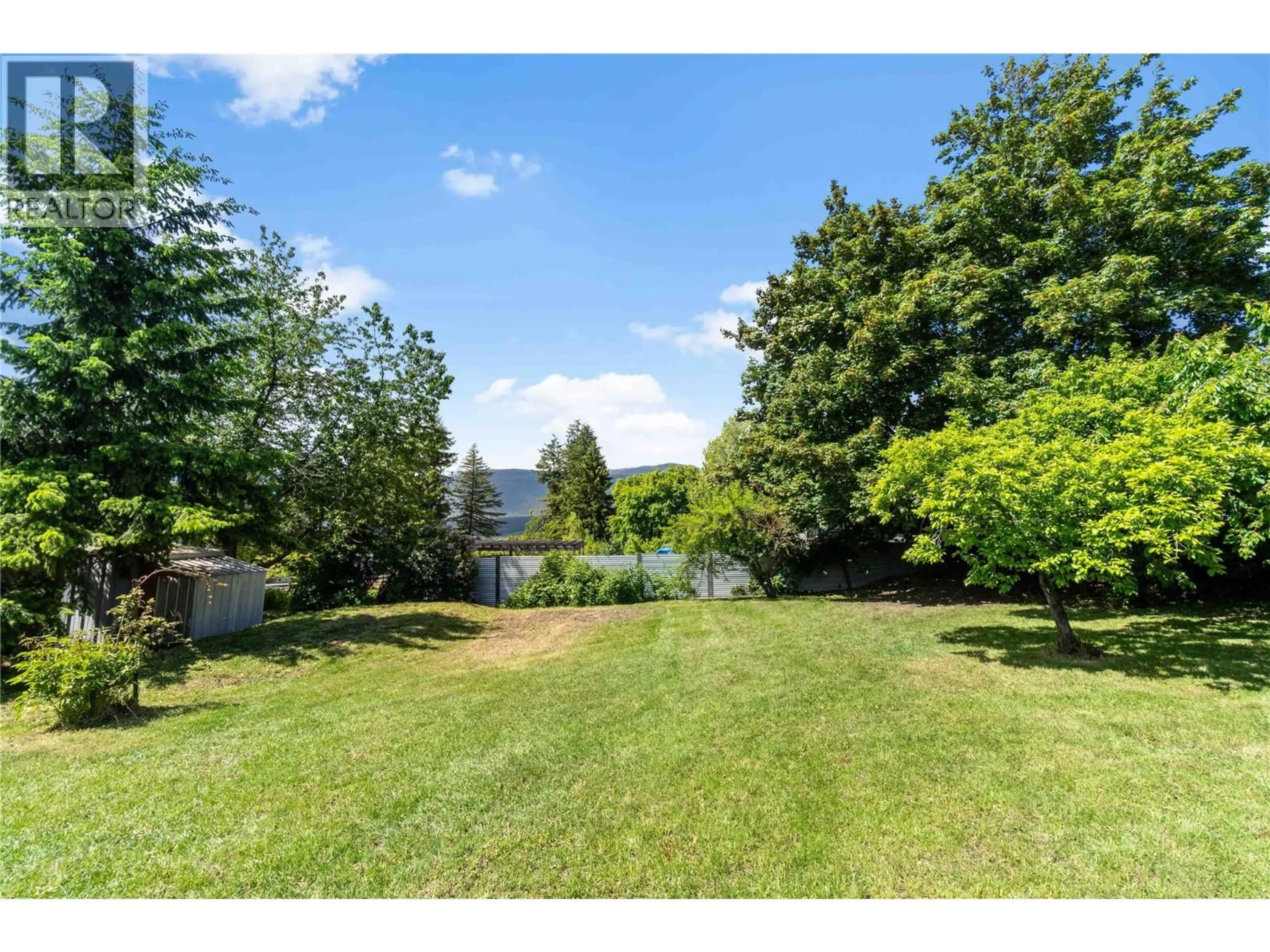 A pic from outside/outdoor area/front of a property/back of a property/a pic from drone, water/lake/river/ocean view for 2941 30 STREET NORTHEAST, Salmon Arm British Columbia V1E3G7