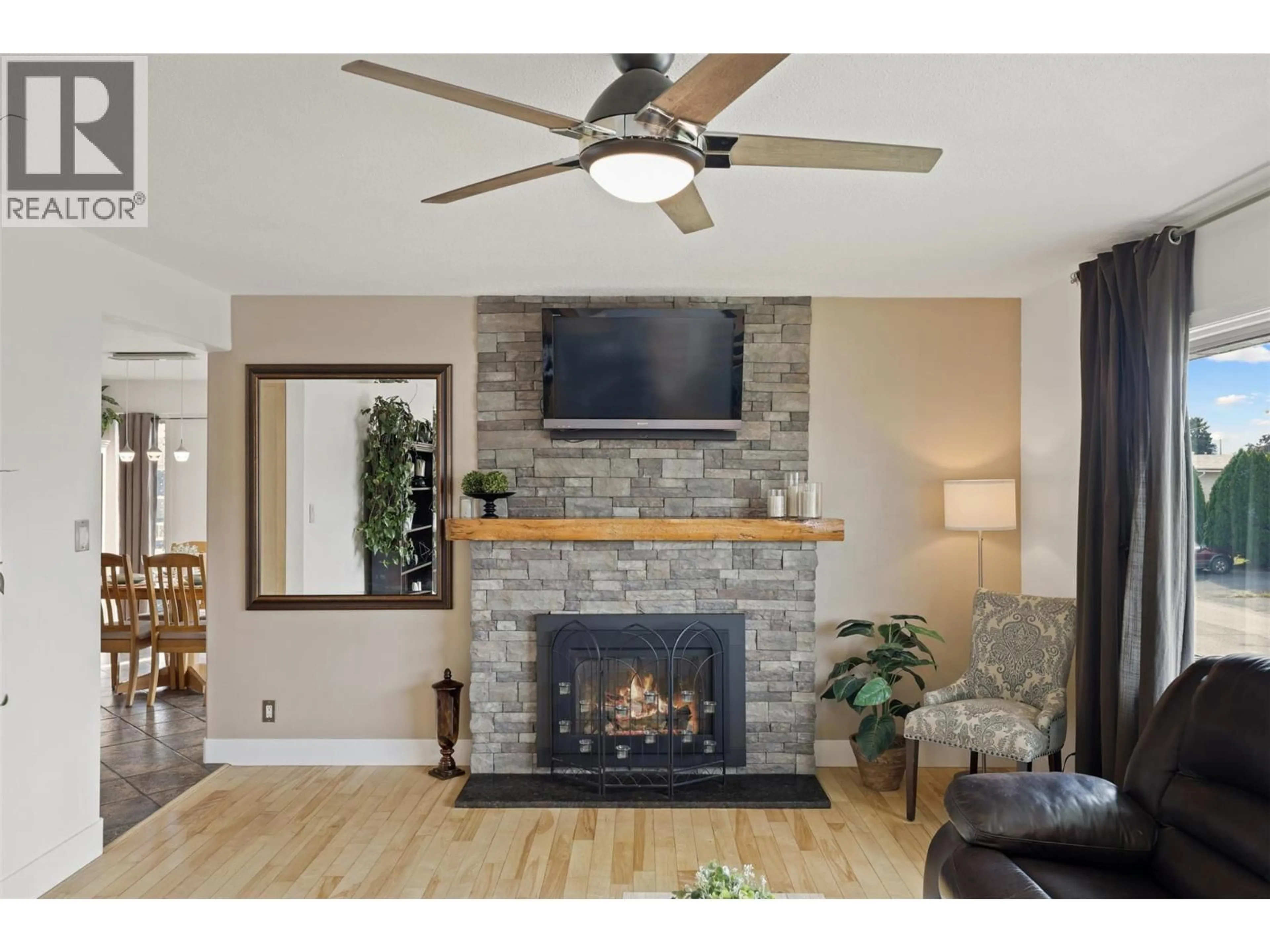 Living room with furniture, wood/laminate floor for 1278 KIMBERLEY CRESCENT, Kamloops British Columbia V2B3B7