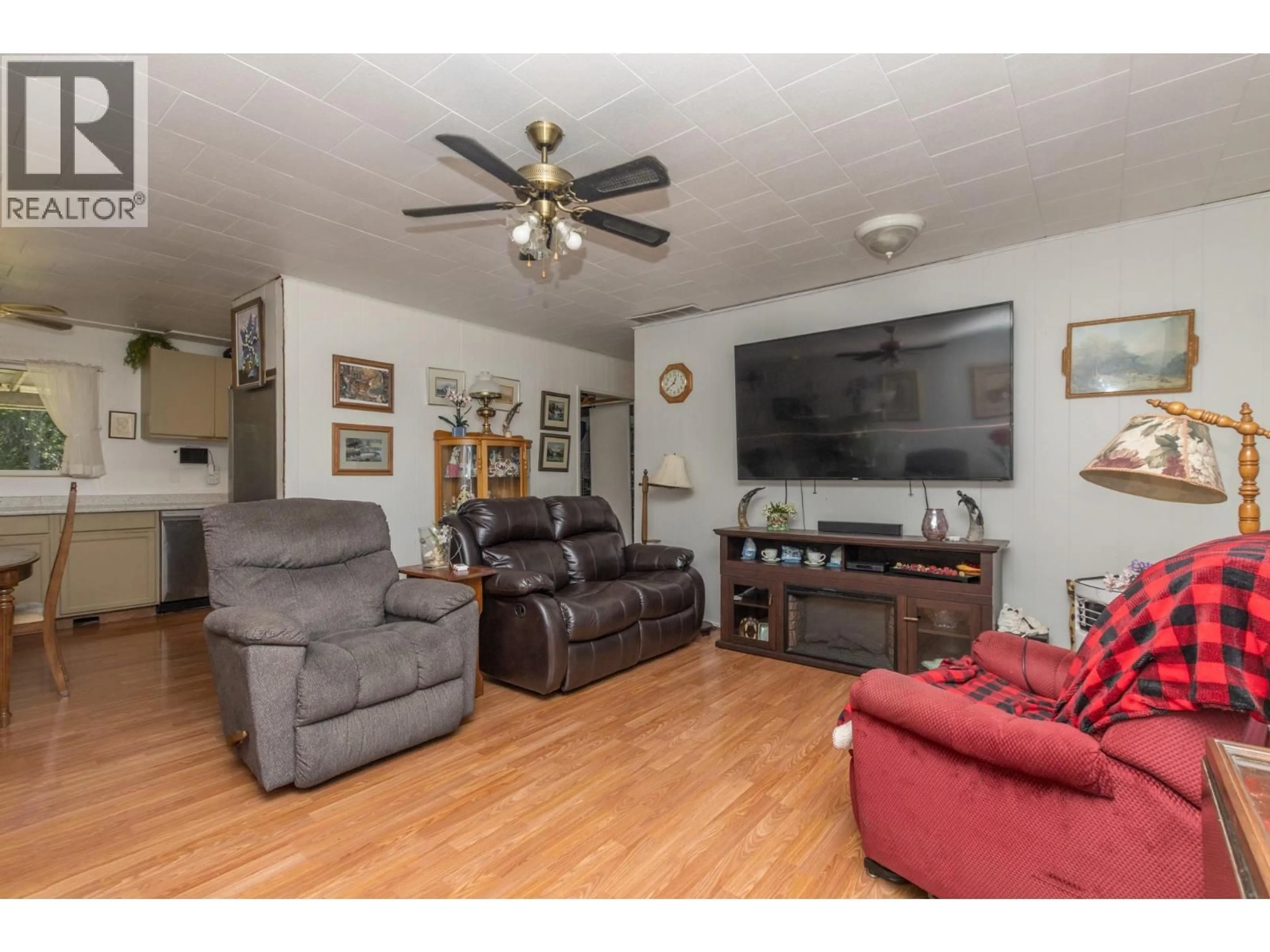 Living room with furniture, wood/laminate floor for 7050 54 STREET NORTHEAST, Salmon Arm British Columbia V0E1K0