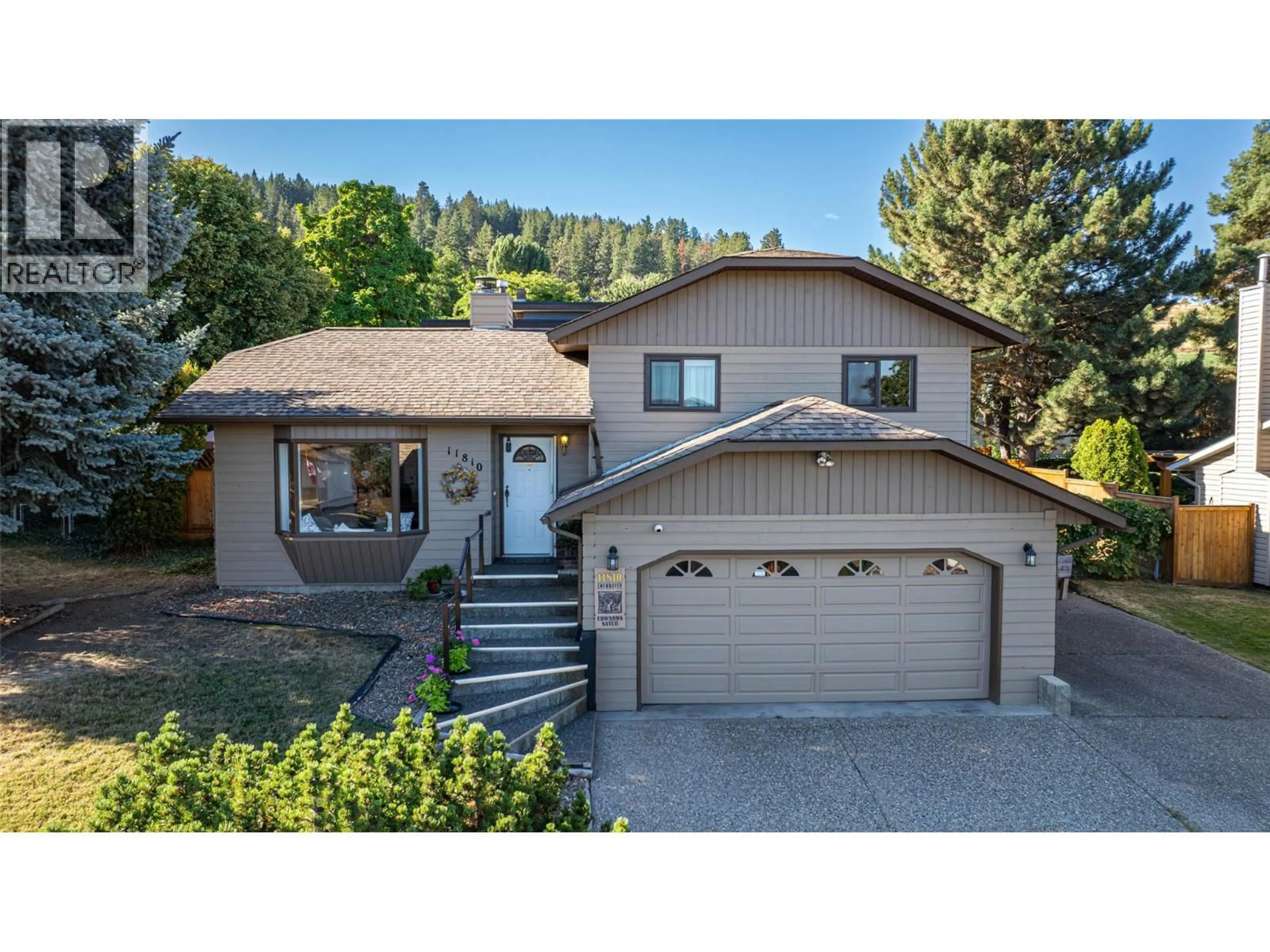Home with vinyl exterior material, street for 11810 LOCHHAVEN DRIVE, Coldstream British Columbia V1B2H1