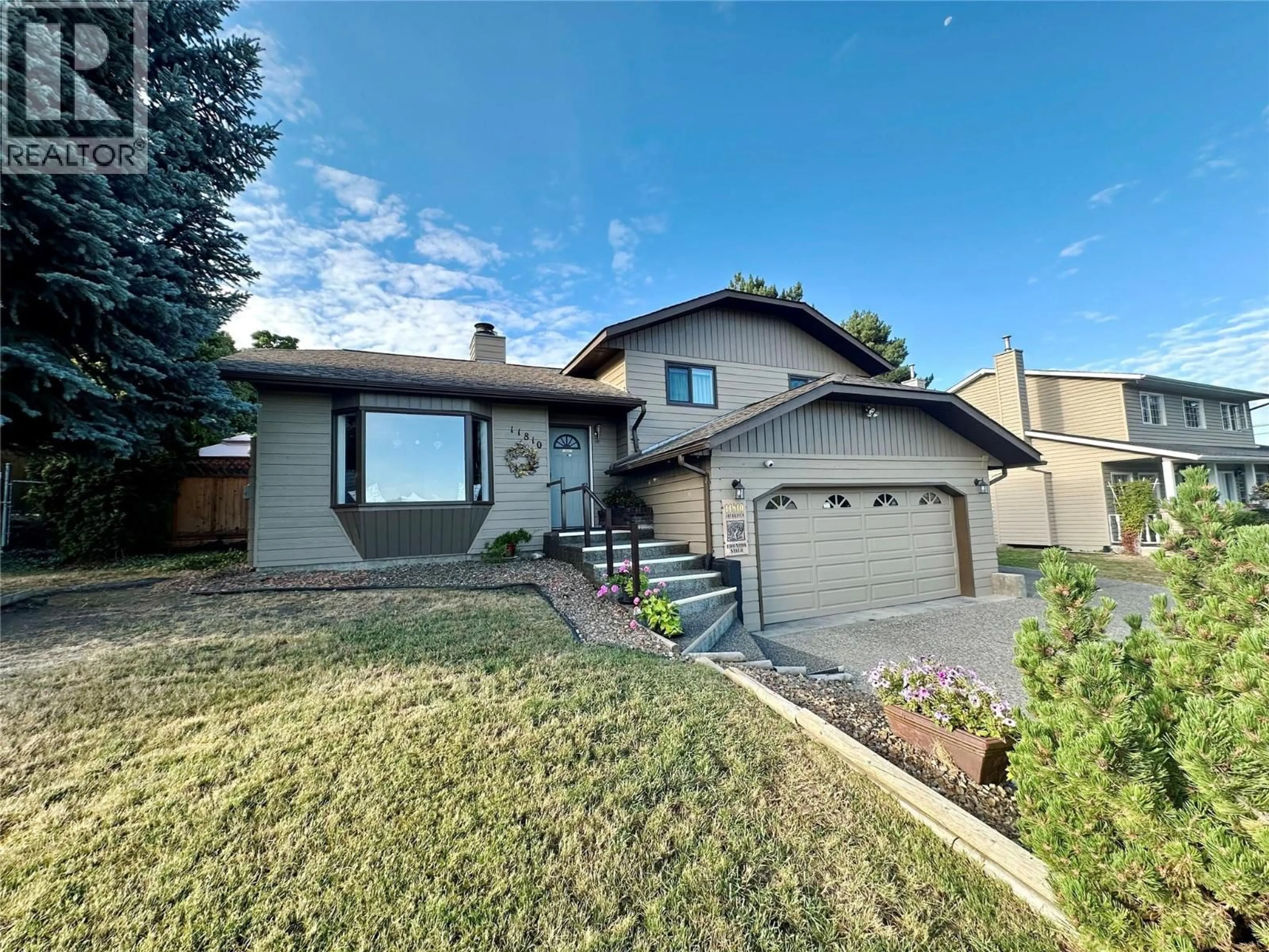 Home with vinyl exterior material, street for 11810 LOCHHAVEN DRIVE, Coldstream British Columbia V1B2H1