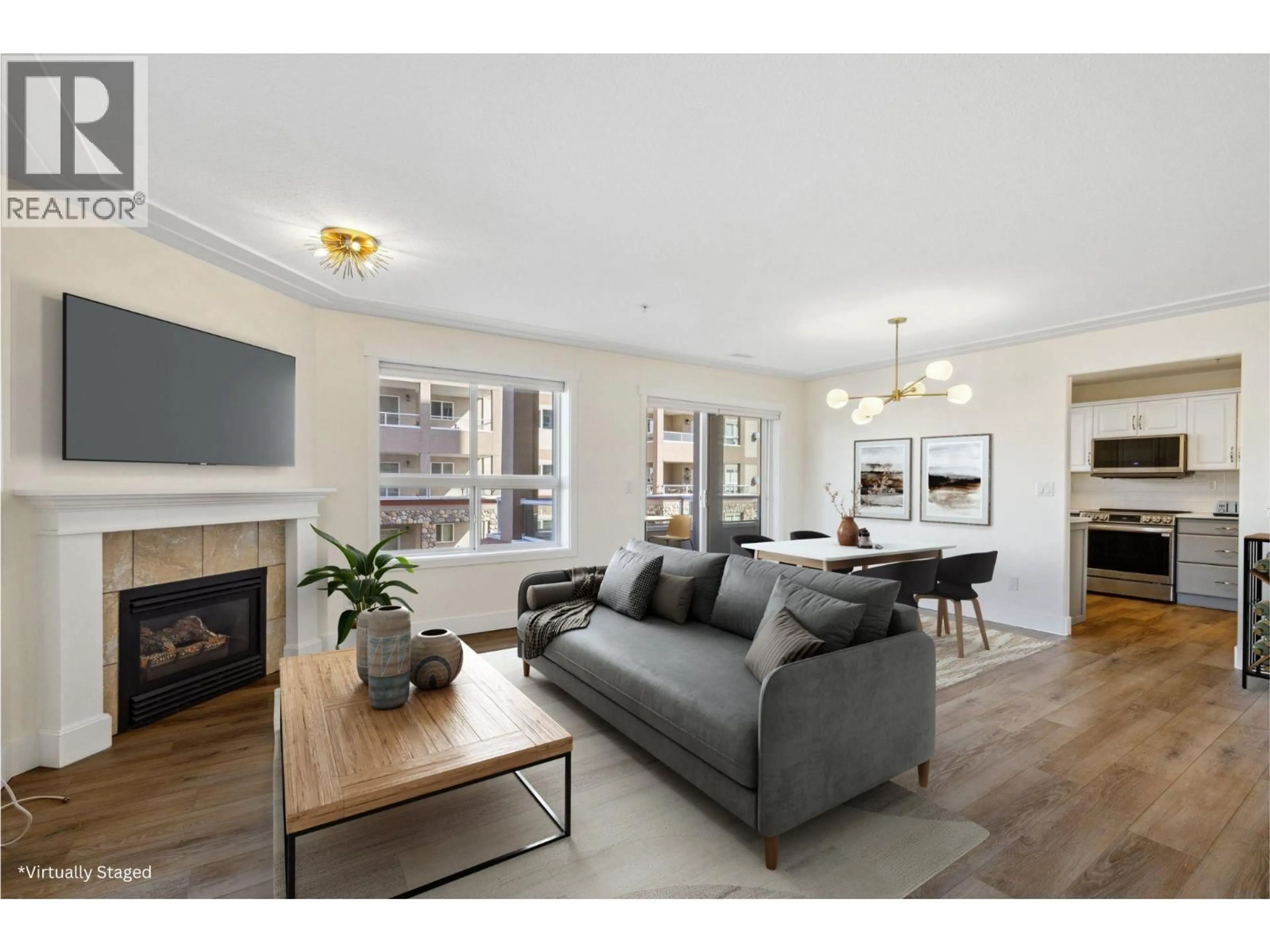 Living room with furniture, wood/laminate floor for 307 - 1967 UNDERHILL STREET, Kelowna British Columbia V1X8C9