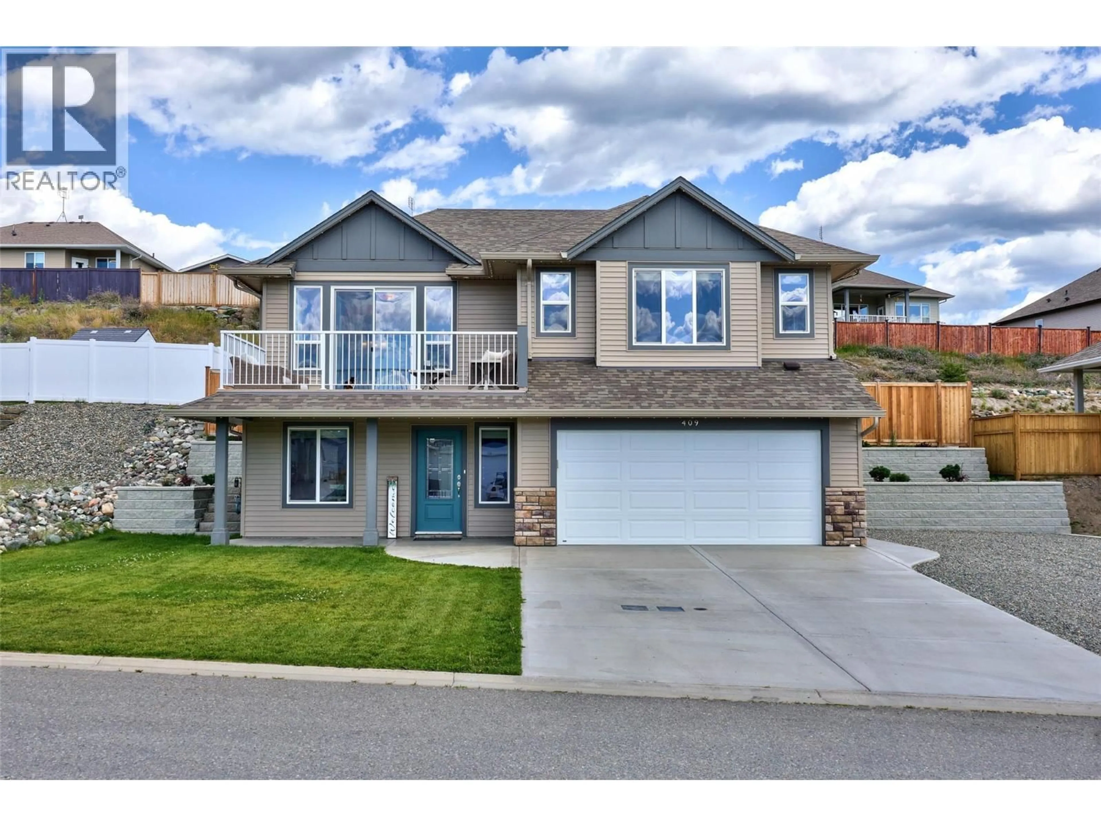 Home with brick exterior material, street for 409 DALADON DRIVE, Logan Lake British Columbia V0K1W0