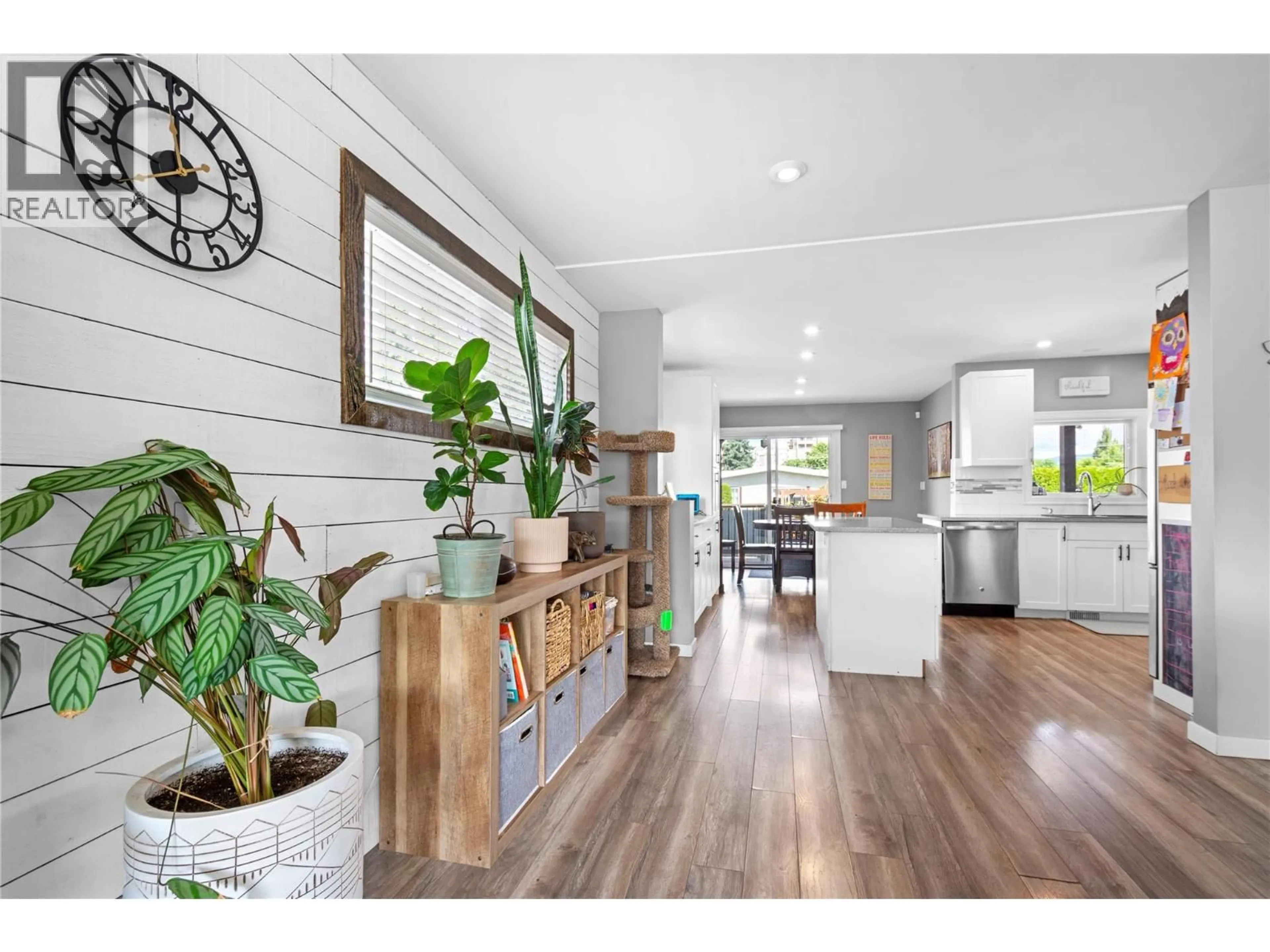 Open concept kitchen, wood/laminate floor for 117 MCCULLOCH DRIVE, Penticton British Columbia V2A3P6