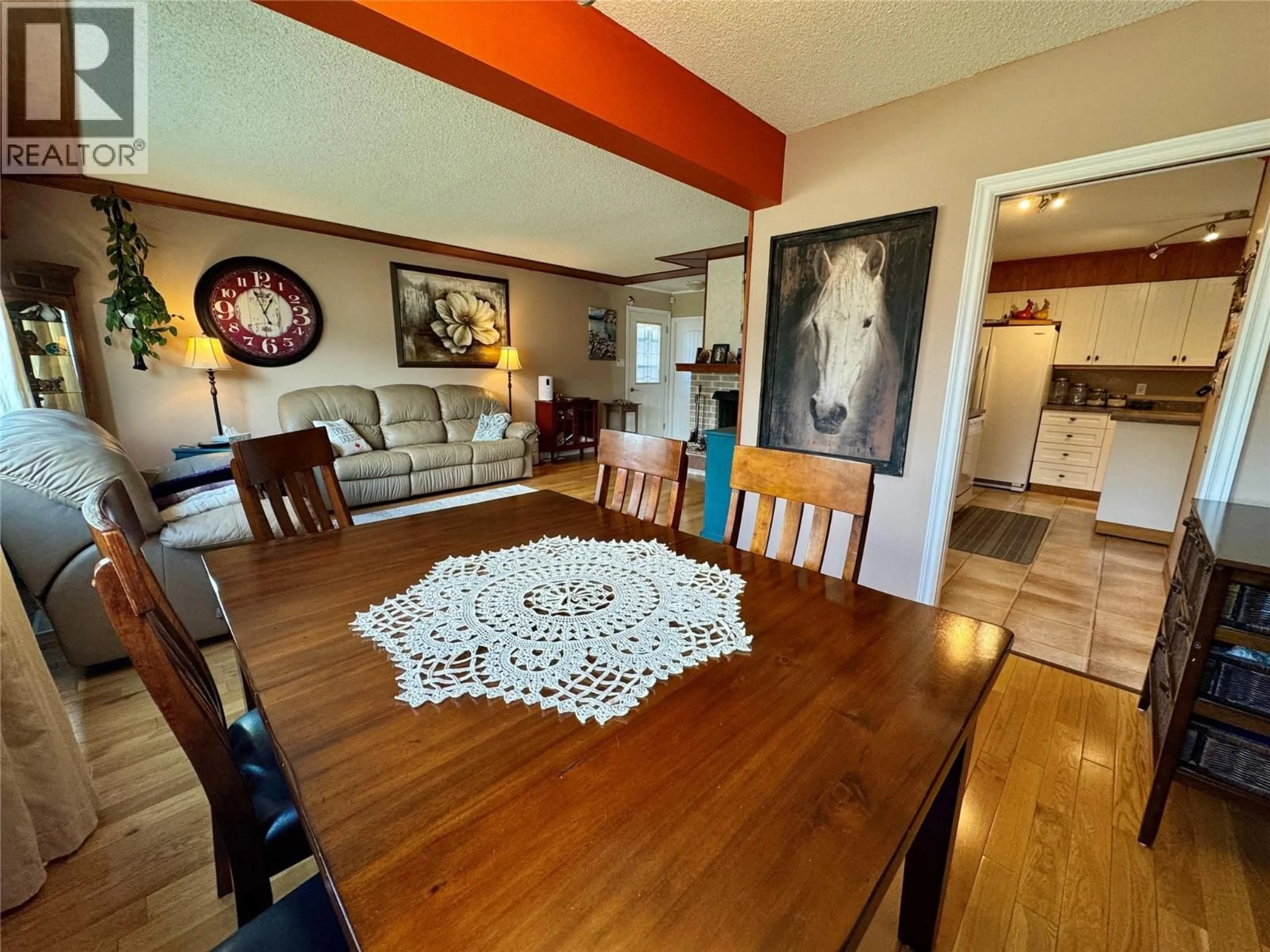Dining room, wood/laminate floor for 1537 95 AVENUE, Dawson Creek British Columbia V1G1J9