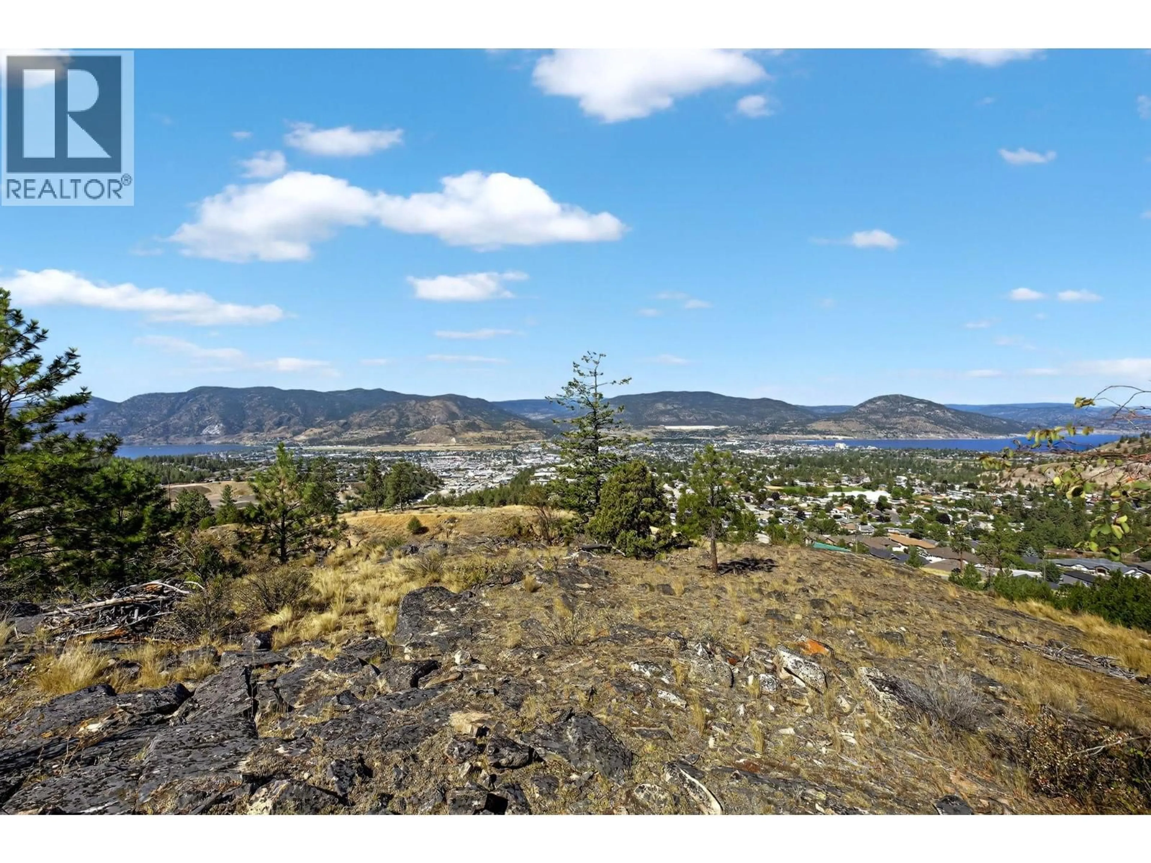 A pic from outside/outdoor area/front of a property/back of a property/a pic from drone, mountain view for 138 SALIKEN DRIVE, Penticton British Columbia V2A8V6