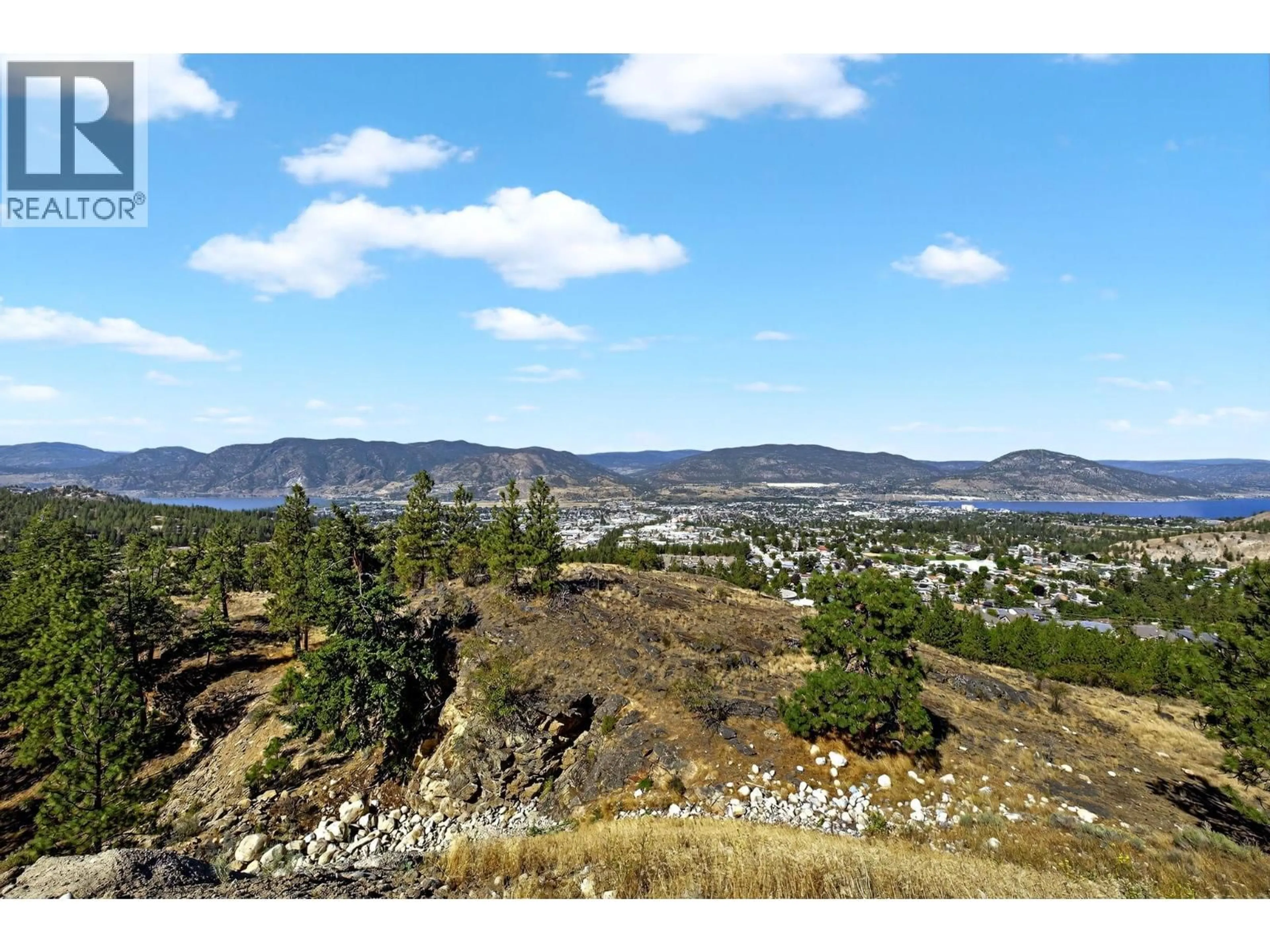 A pic from outside/outdoor area/front of a property/back of a property/a pic from drone, mountain view for 138 SALIKEN DRIVE, Penticton British Columbia V2A8V6
