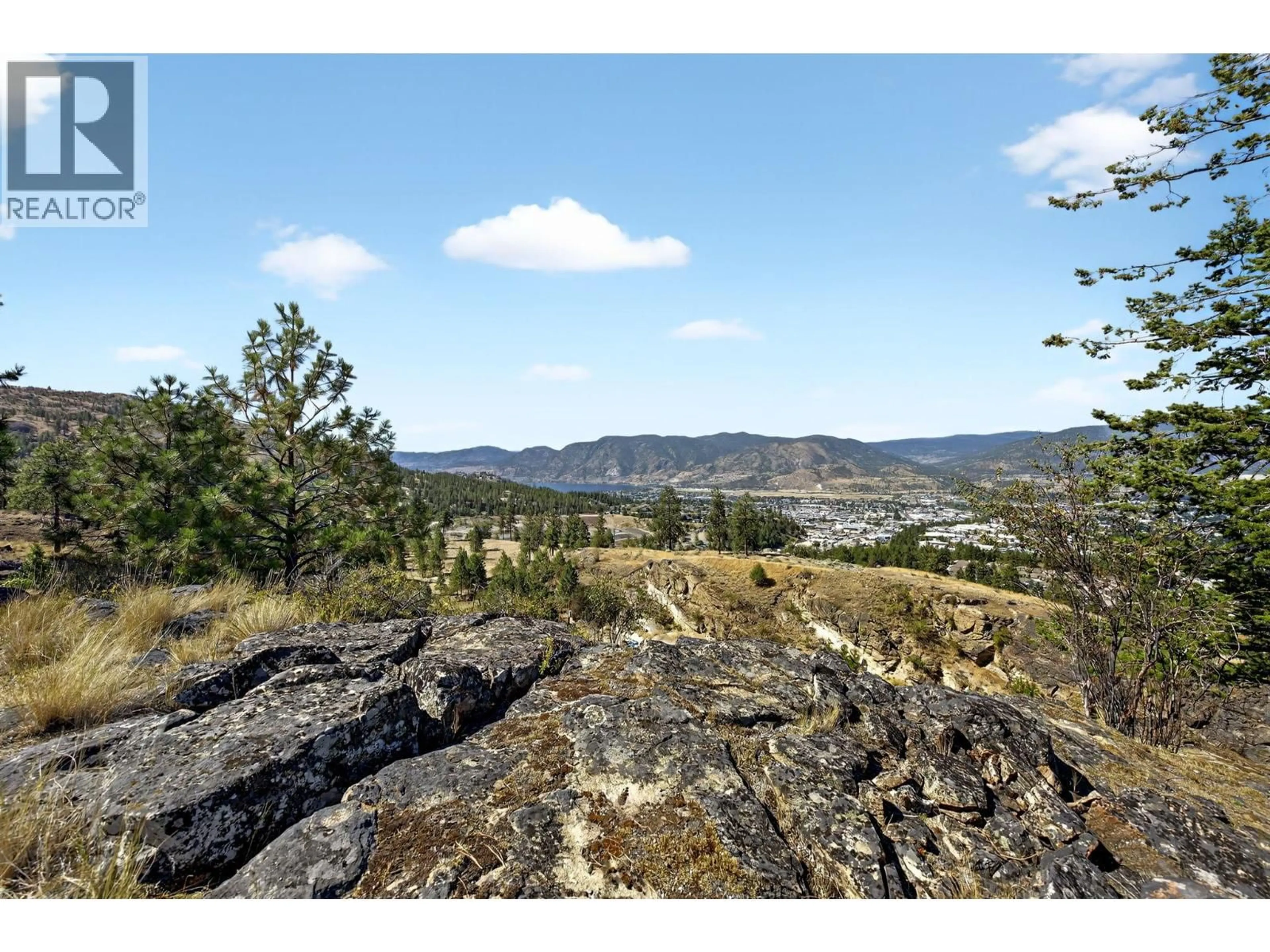 A pic from outside/outdoor area/front of a property/back of a property/a pic from drone, mountain view for 138 SALIKEN DRIVE, Penticton British Columbia V2A8V6