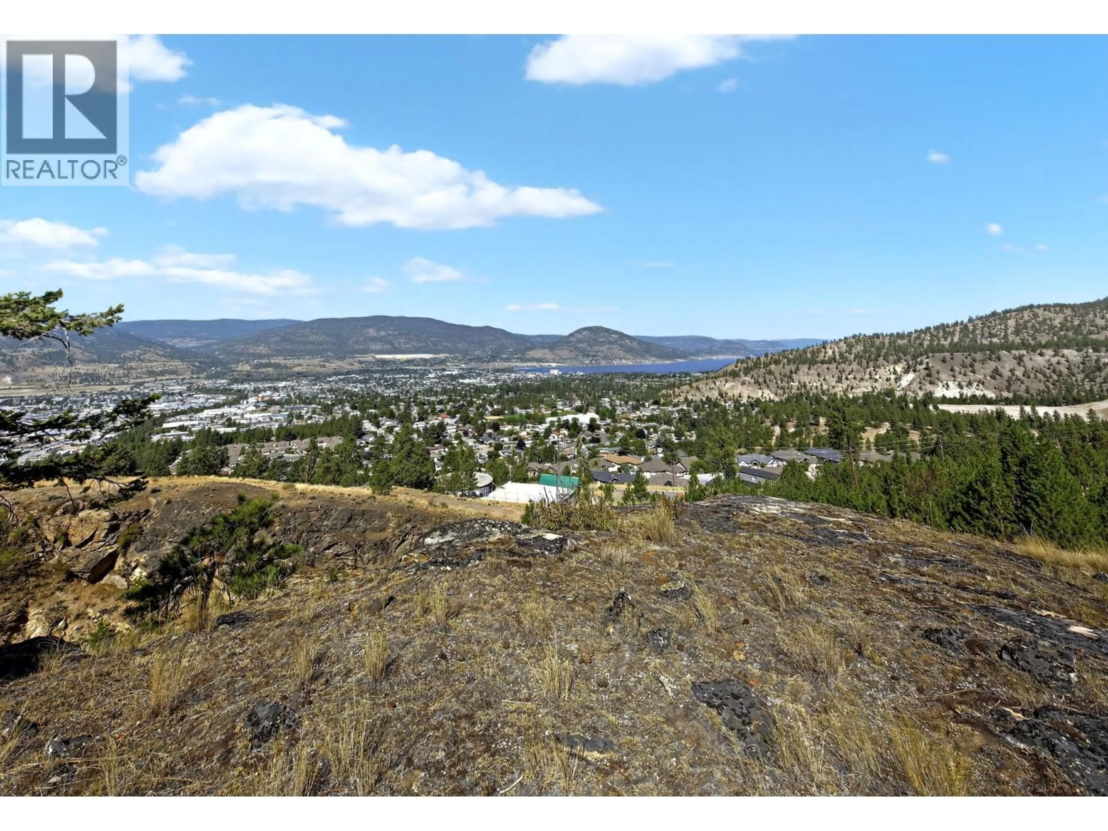 A pic from outside/outdoor area/front of a property/back of a property/a pic from drone, mountain view for 138 SALIKEN DRIVE, Penticton British Columbia V2A8V6