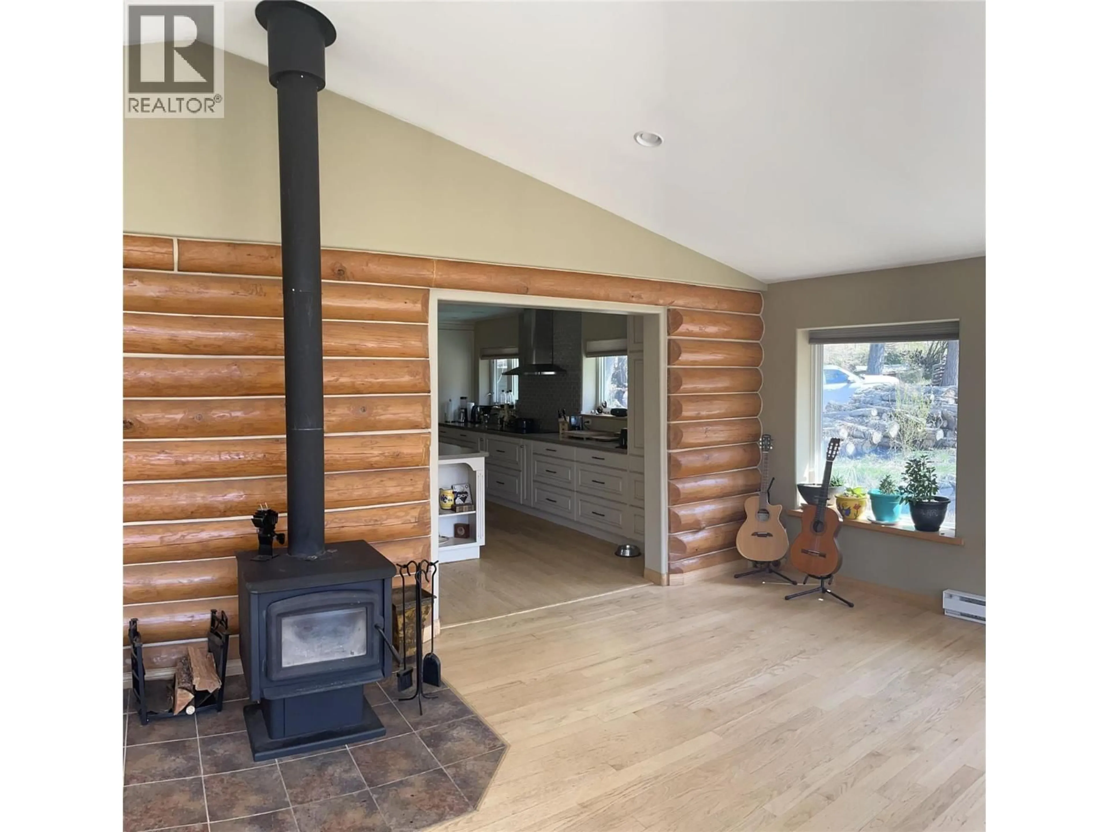 Open concept kitchen, wood/laminate floor for 3815 33 HIGHWAY, Westbridge British Columbia V0H1Y0