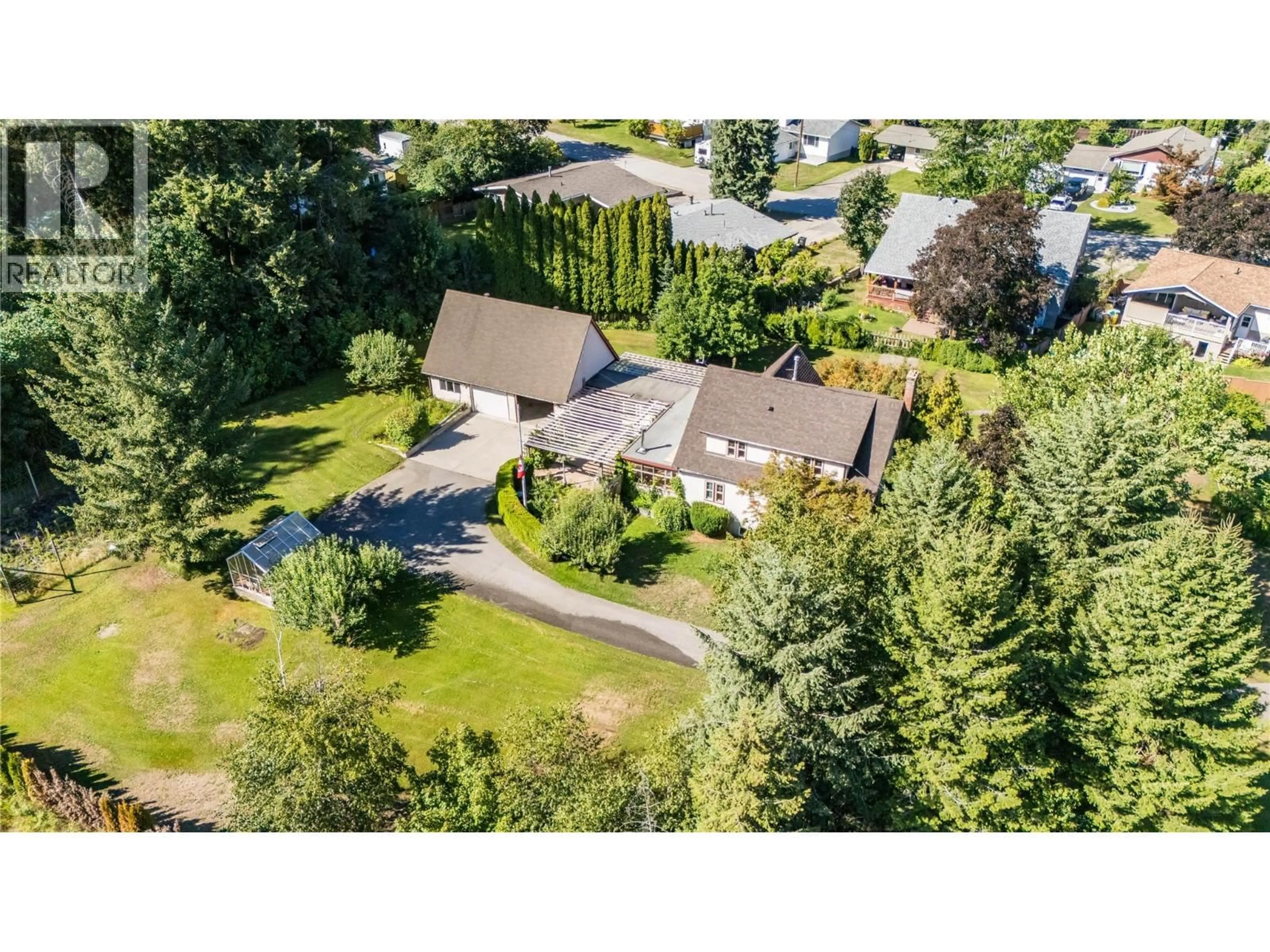 A pic from outside/outdoor area/front of a property/back of a property/a pic from drone, street for 102 18TH STREET, Castlegar British Columbia V1N2M7