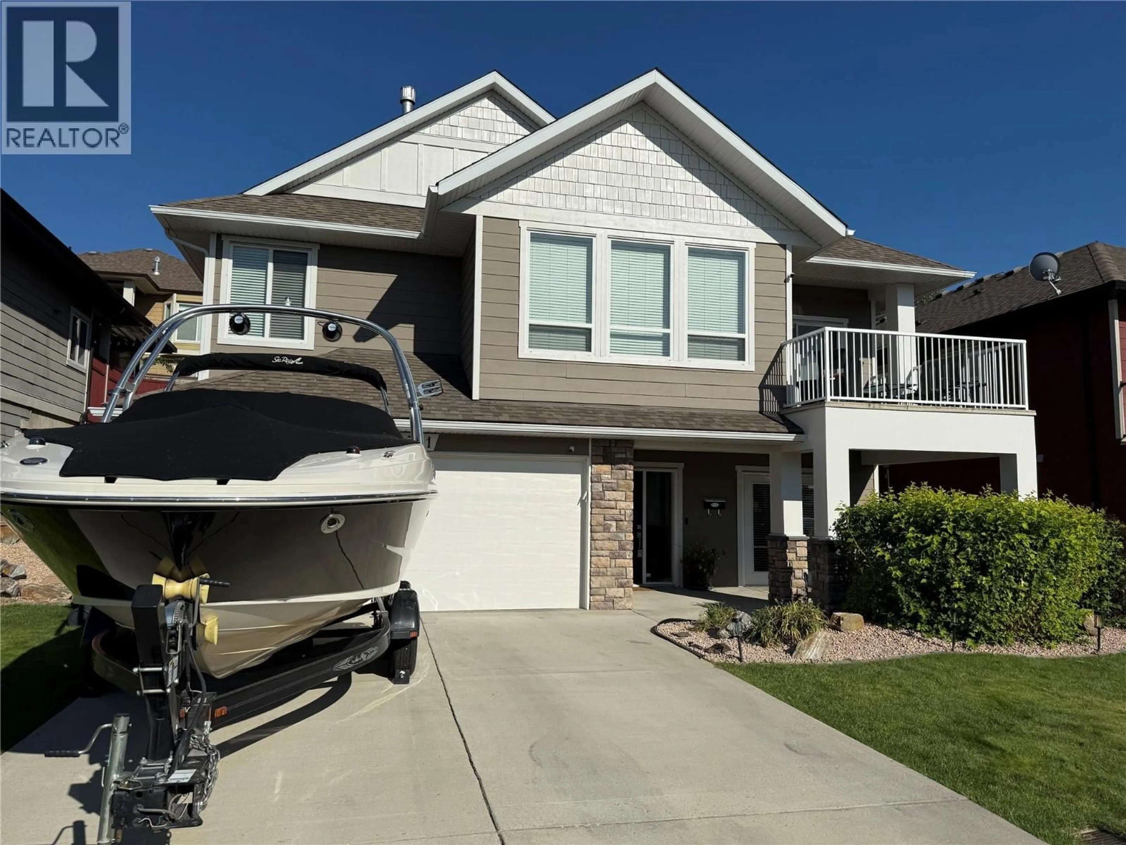 Home with vinyl exterior material, street for 311 POONIAN STREET, Kelowna British Columbia V1X8C3