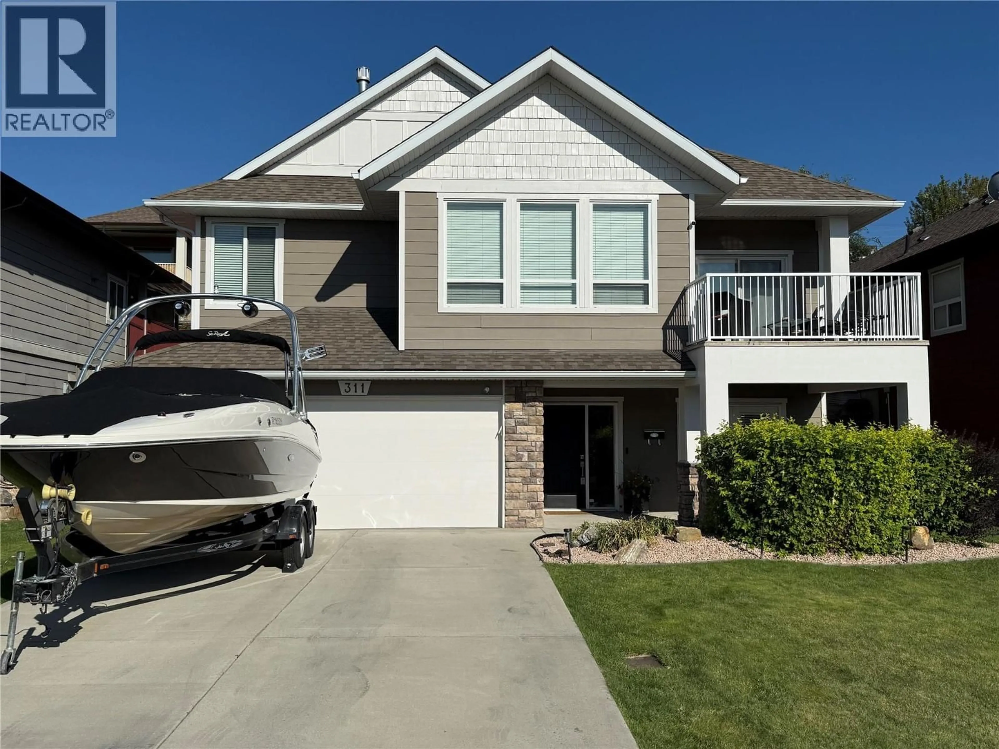 Home with vinyl exterior material, street for 311 POONIAN STREET, Kelowna British Columbia V1X8C3