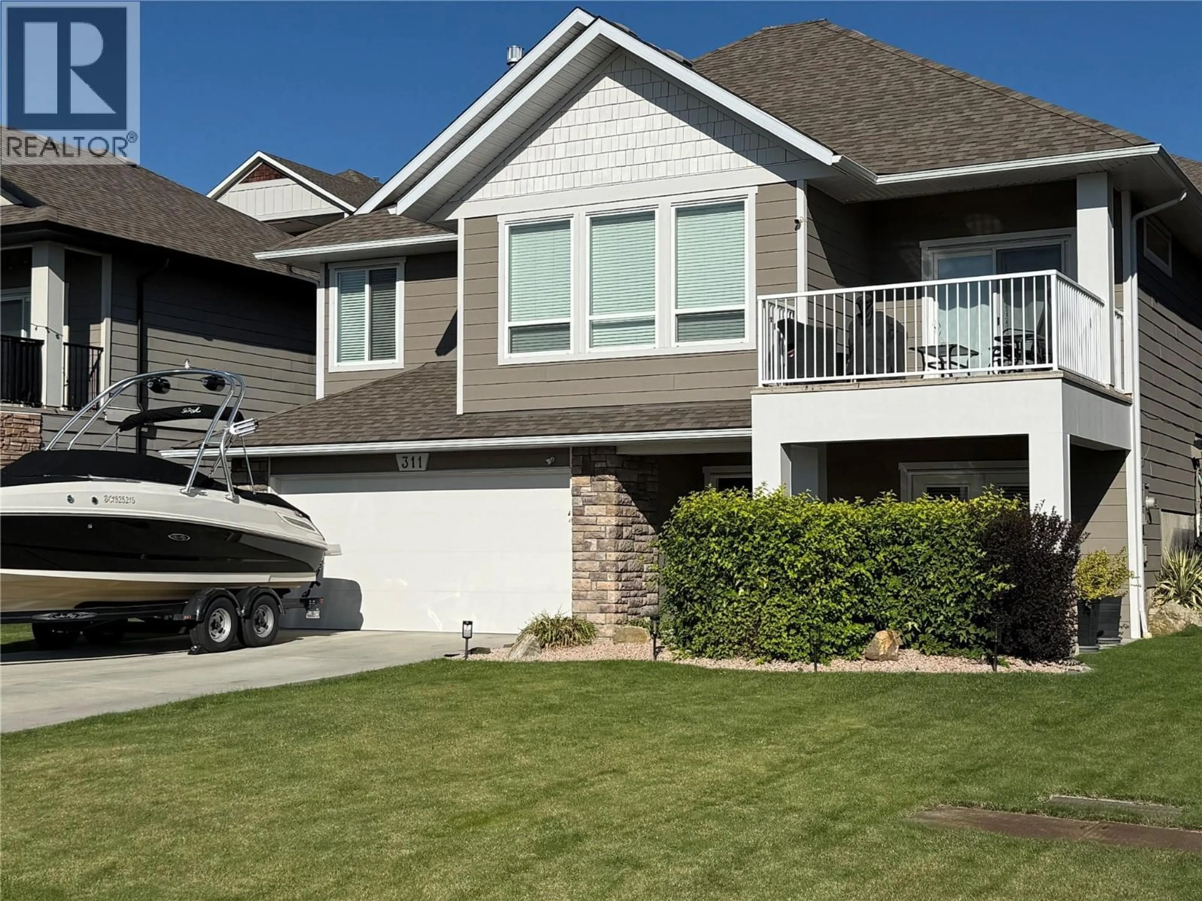 Home with vinyl exterior material, street for 311 POONIAN STREET, Kelowna British Columbia V1X8C3