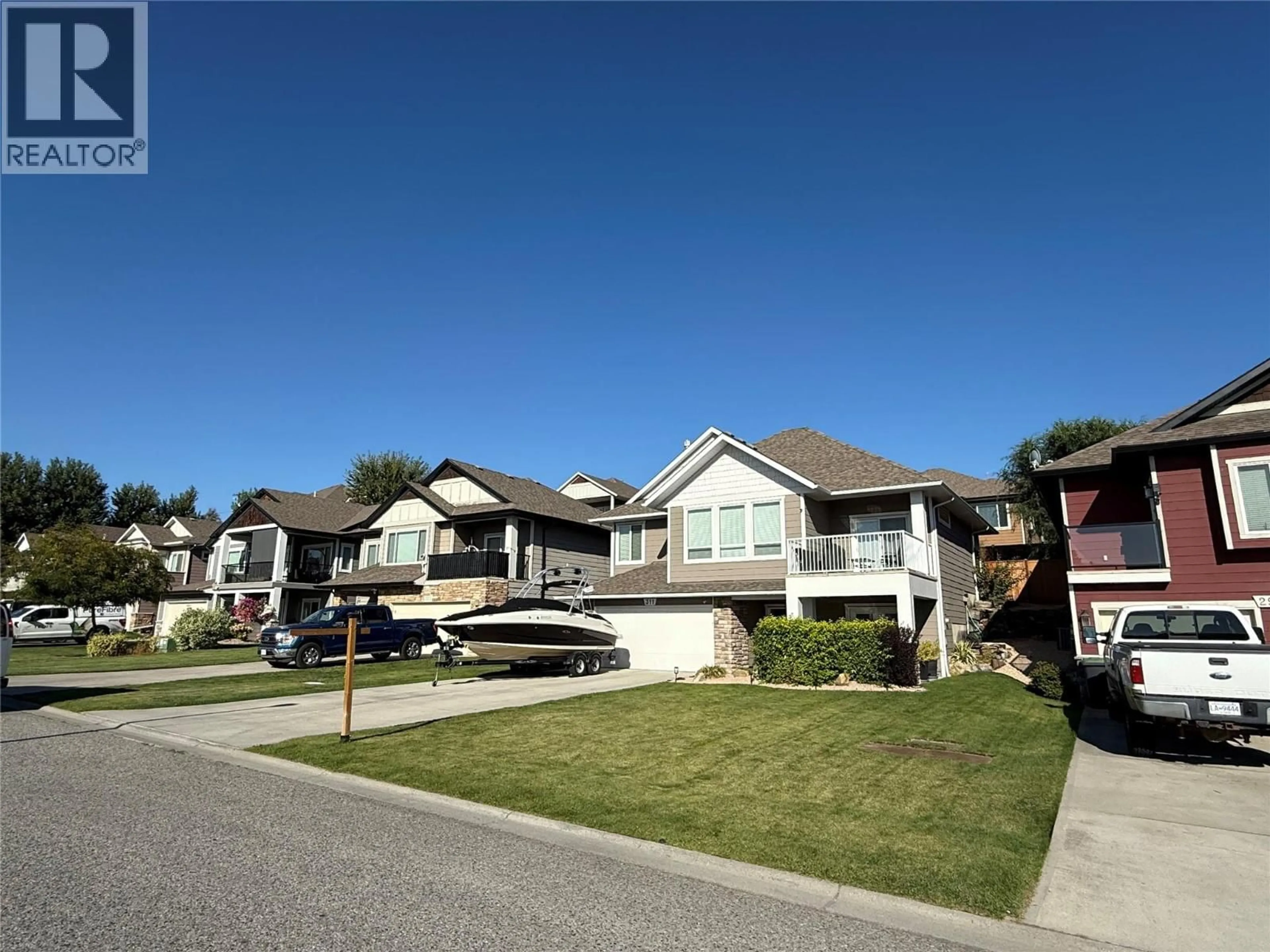 Home with vinyl exterior material, street for 311 POONIAN STREET, Kelowna British Columbia V1X8C3