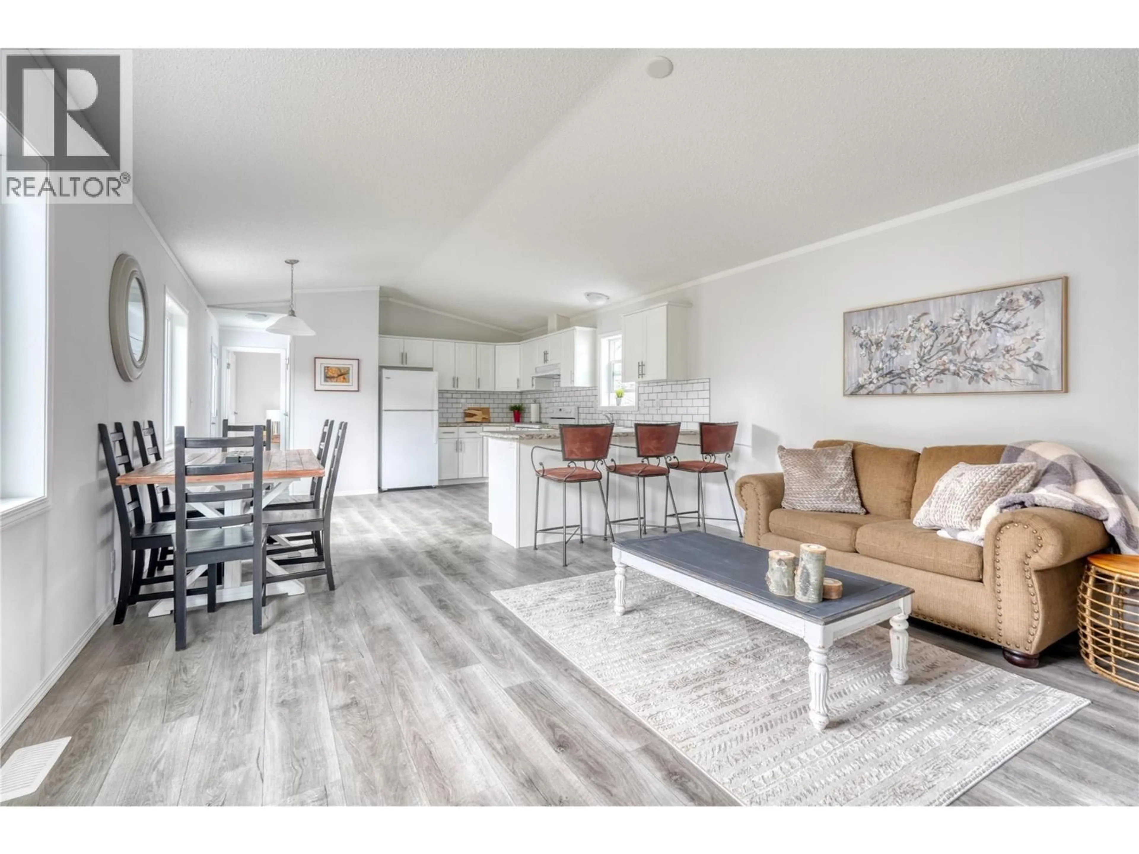 Open concept kitchen, wood/laminate floor for 721 6TH AVENUE, Keremeos British Columbia V0X1N3