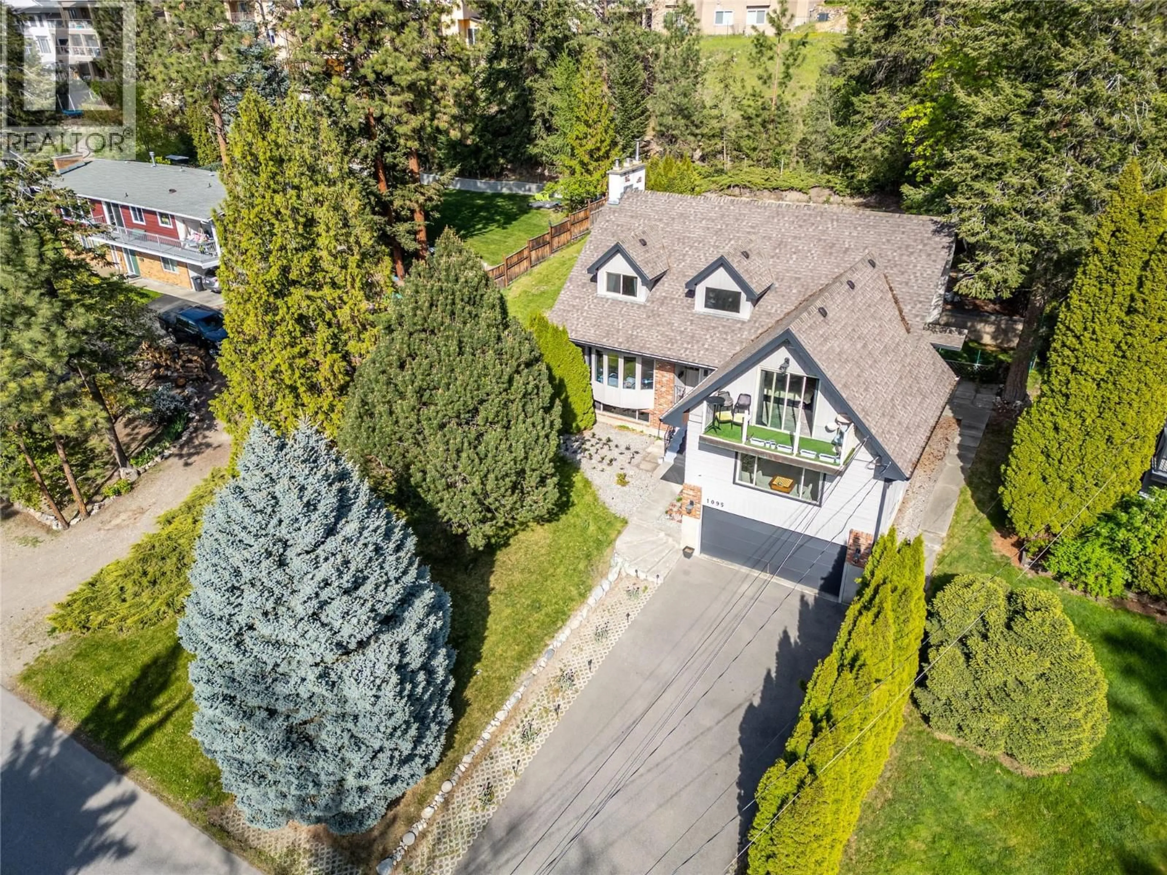 A pic from outside/outdoor area/front of a property/back of a property/a pic from drone, street for 1095 TOOVEY ROAD, Kelowna British Columbia V1X6R2