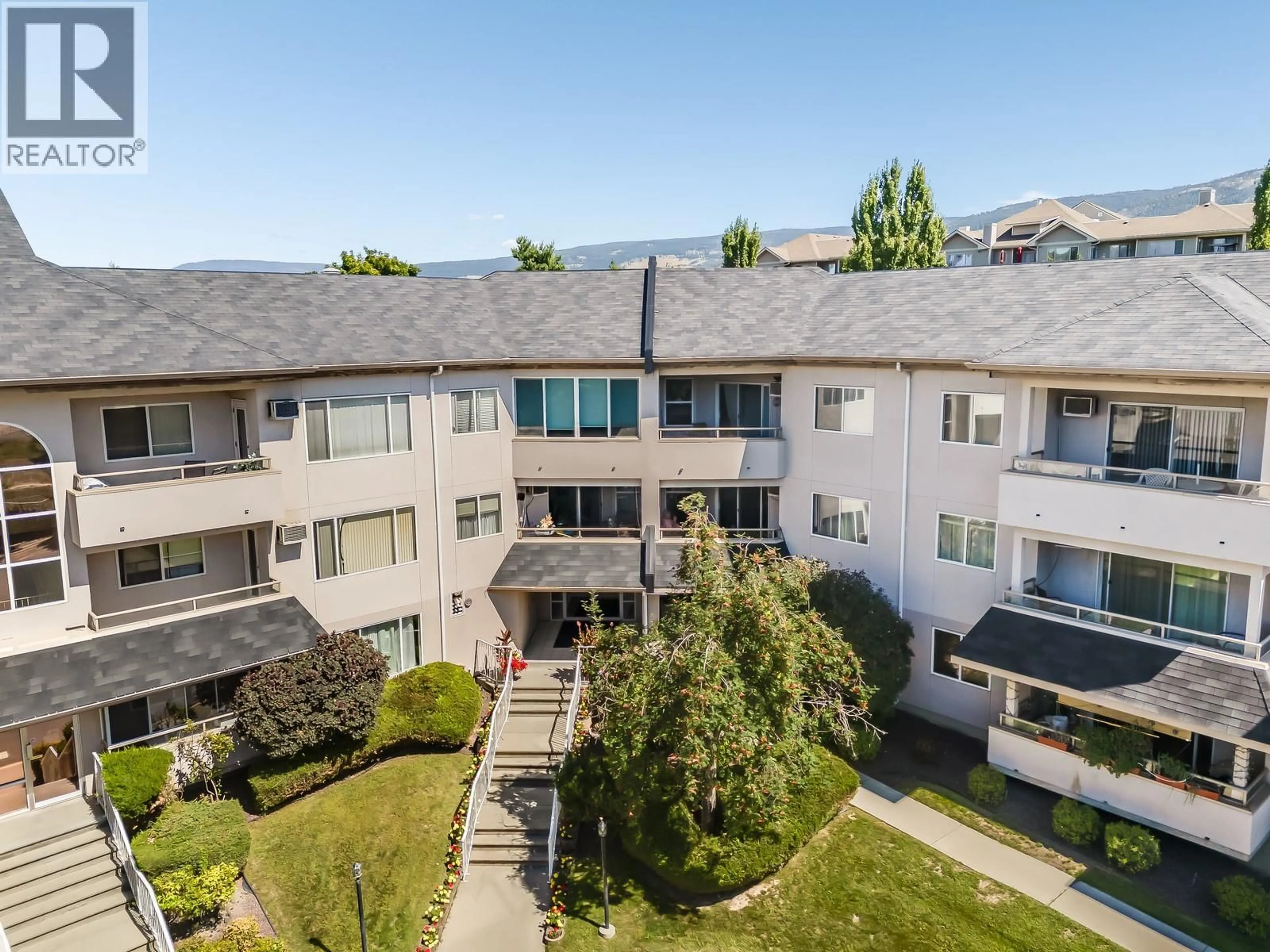 A pic from outside/outdoor area/front of a property/back of a property/a pic from drone, mountain view for 218 - 255 AURORA CRESCENT, Kelowna British Columbia V1X7L8
