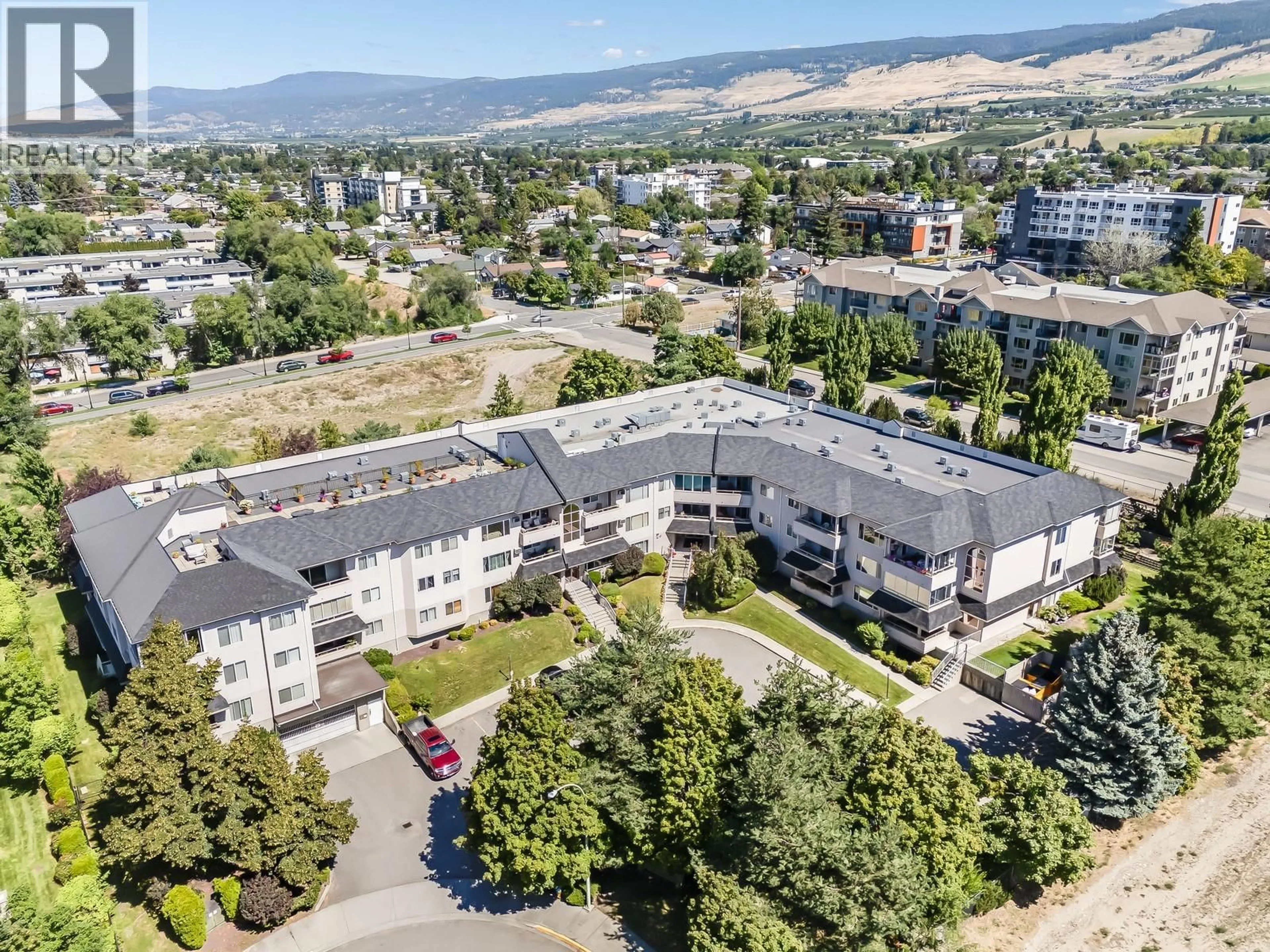 A pic from outside/outdoor area/front of a property/back of a property/a pic from drone, mountain view for 218 - 255 AURORA CRESCENT, Kelowna British Columbia V1X7L8