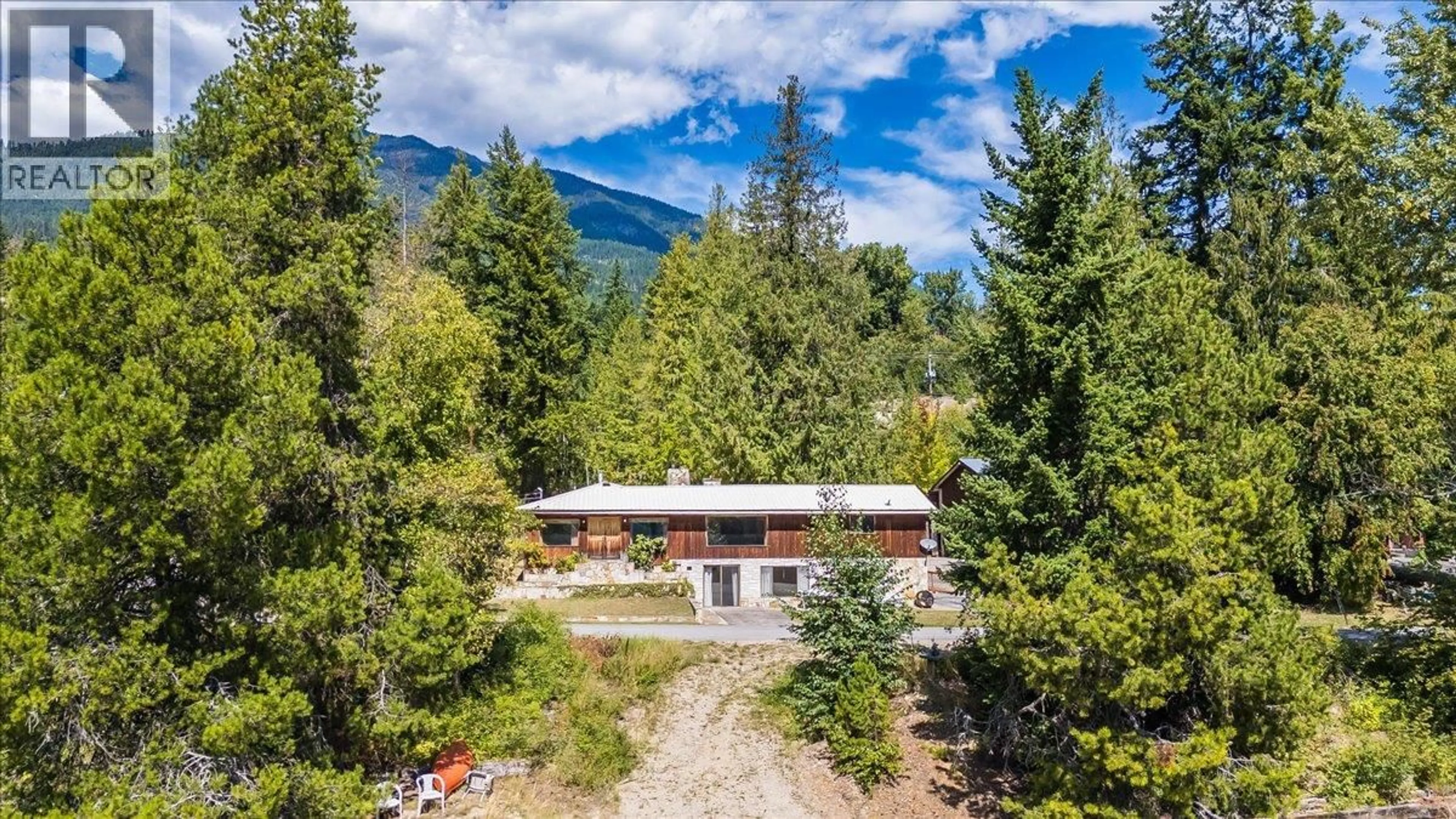 A pic from outside/outdoor area/front of a property/back of a property/a pic from drone, mountain view for 7961 BALFOUR WHARF ROAD, Balfour British Columbia V0G1C0