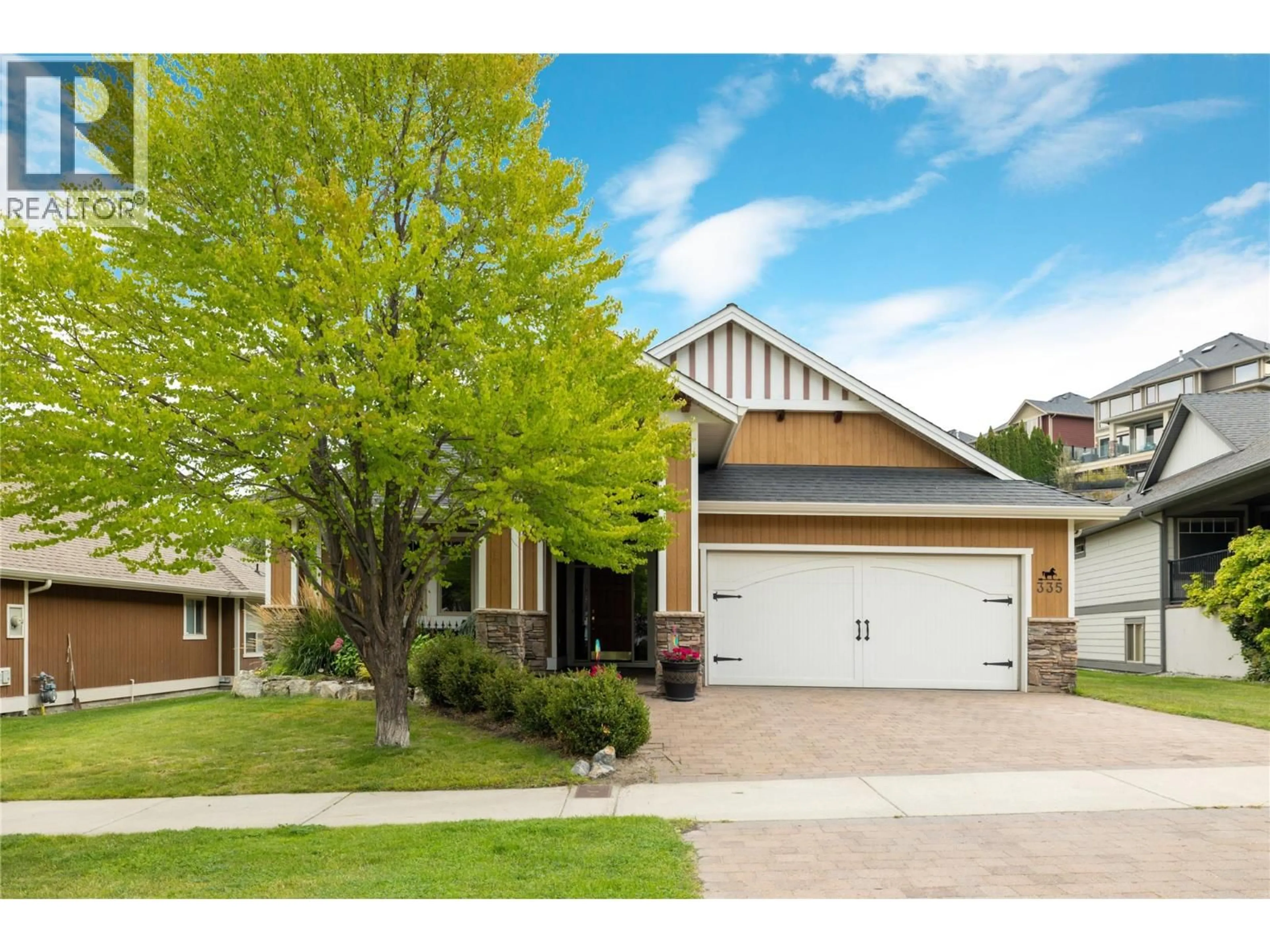 Home with vinyl exterior material, street for 335 QUILCHENA DRIVE, Kelowna British Columbia V1W4Y9