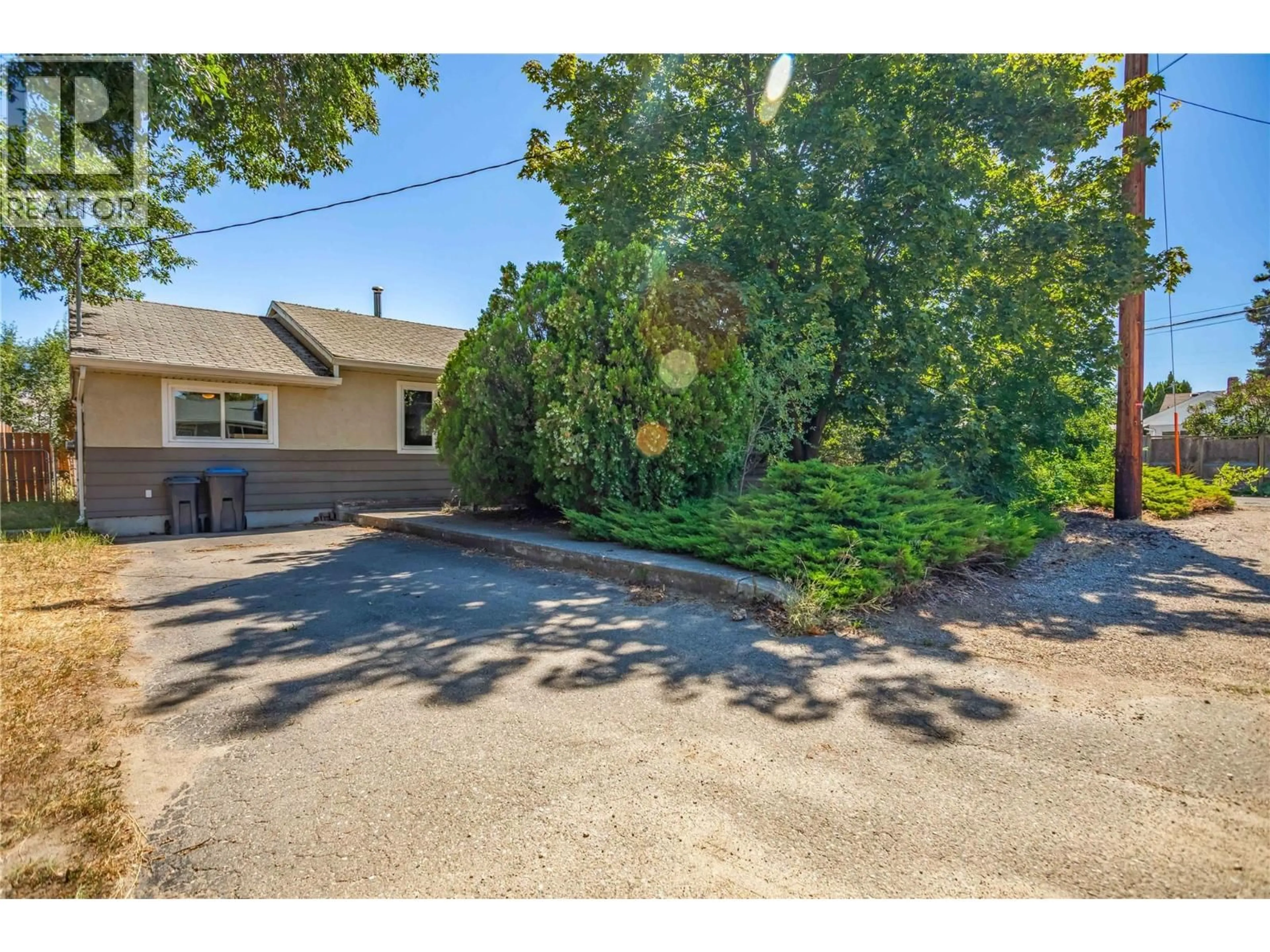 A pic from outside/outdoor area/front of a property/back of a property/a pic from drone, street for 455 DONHAUSER ROAD, Kelowna British Columbia V1X3G2