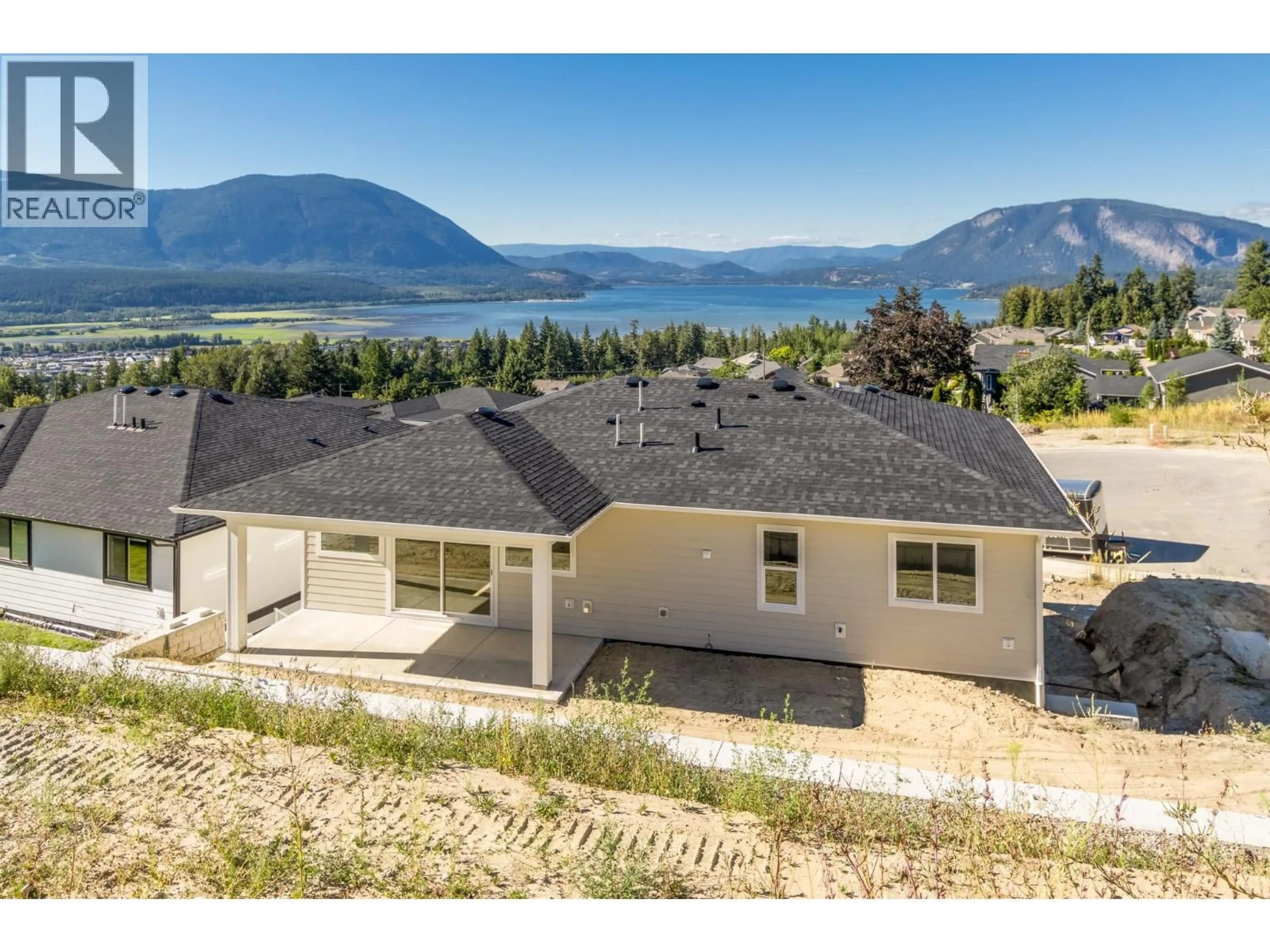 A pic from outside/outdoor area/front of a property/back of a property/a pic from drone, water/lake/river/ocean view for 1160 16 AVENUE SOUTHEAST, Salmon Arm British Columbia V1E2R5