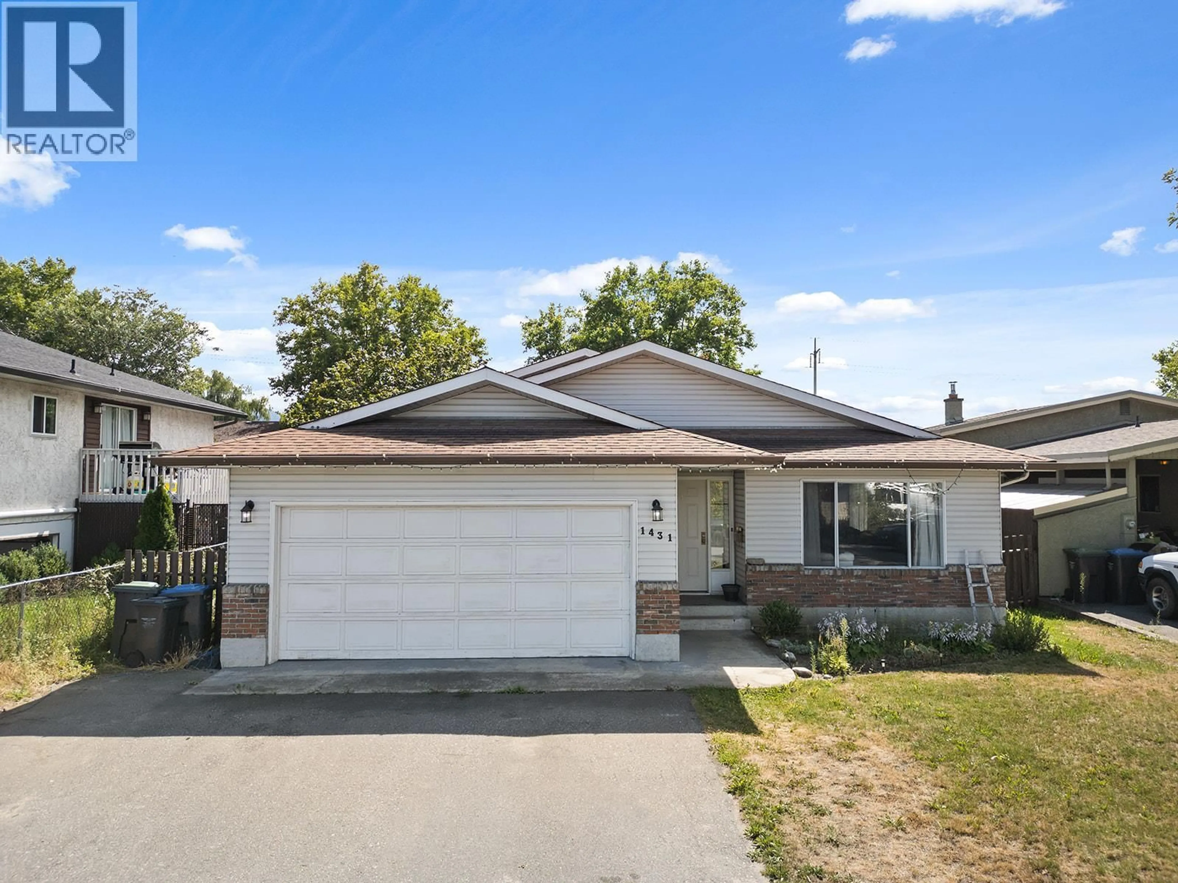 Home with vinyl exterior material, street for 1431 INKAR ROAD, Kelowna British Columbia V1Y8J1