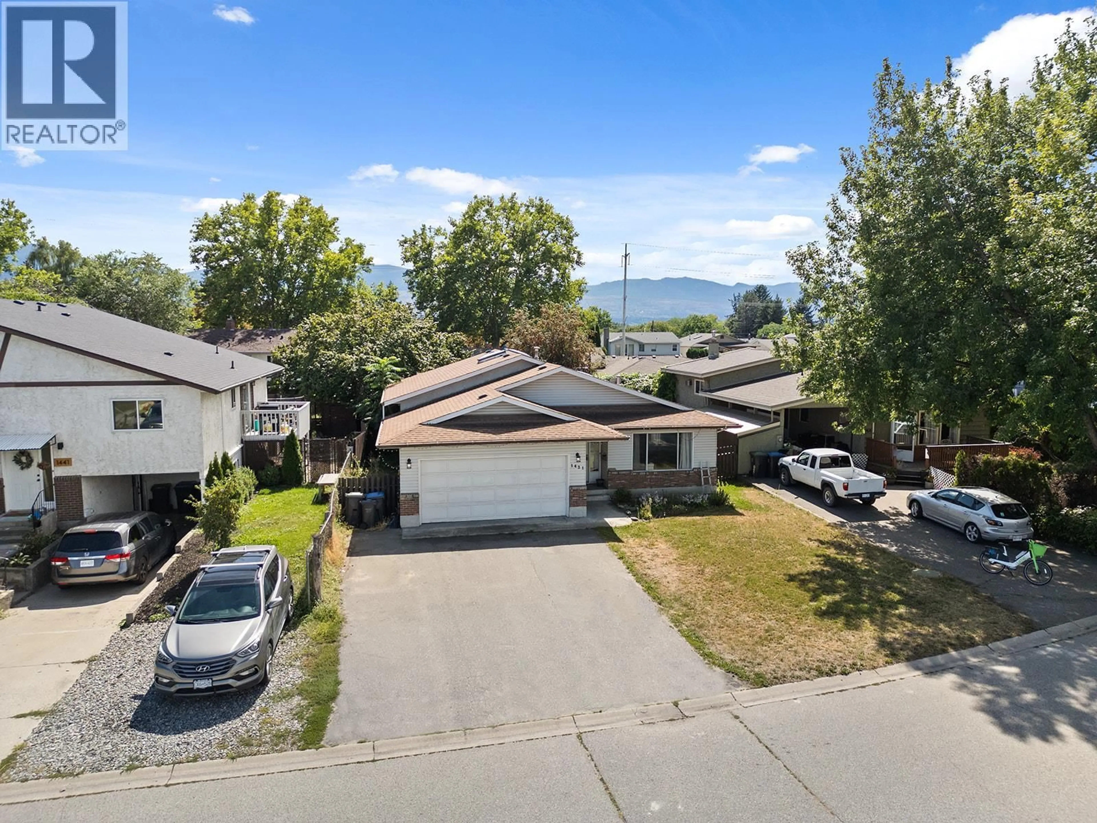 A pic from outside/outdoor area/front of a property/back of a property/a pic from drone, mountain view for 1431 INKAR ROAD, Kelowna British Columbia V1Y8J1
