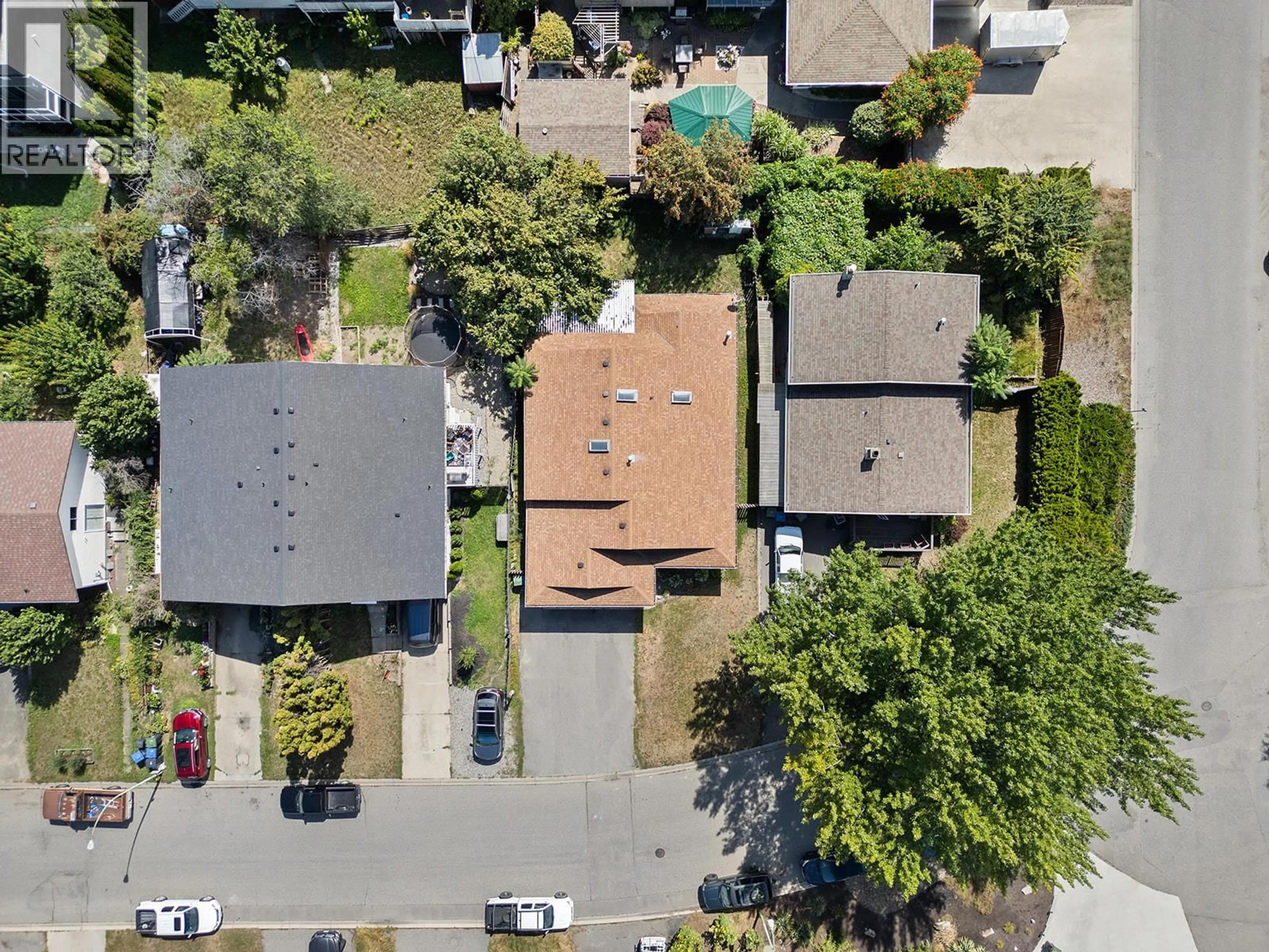 A pic from outside/outdoor area/front of a property/back of a property/a pic from drone, street for 1431 INKAR ROAD, Kelowna British Columbia V1Y8J1