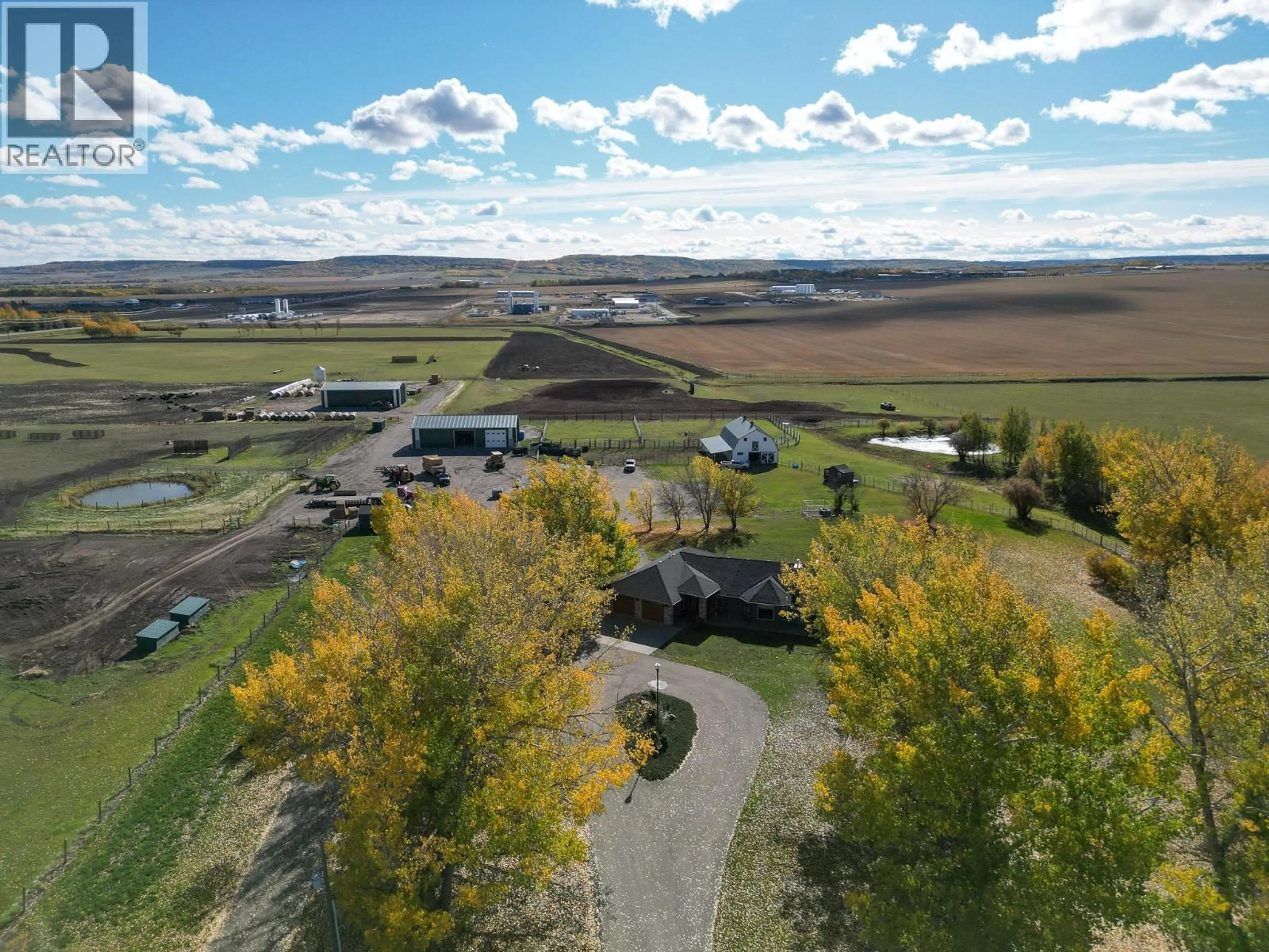 A pic from outside/outdoor area/front of a property/back of a property/a pic from drone, mountain view for 2713 210 ROAD, Dawson Creek British Columbia V1G4H4