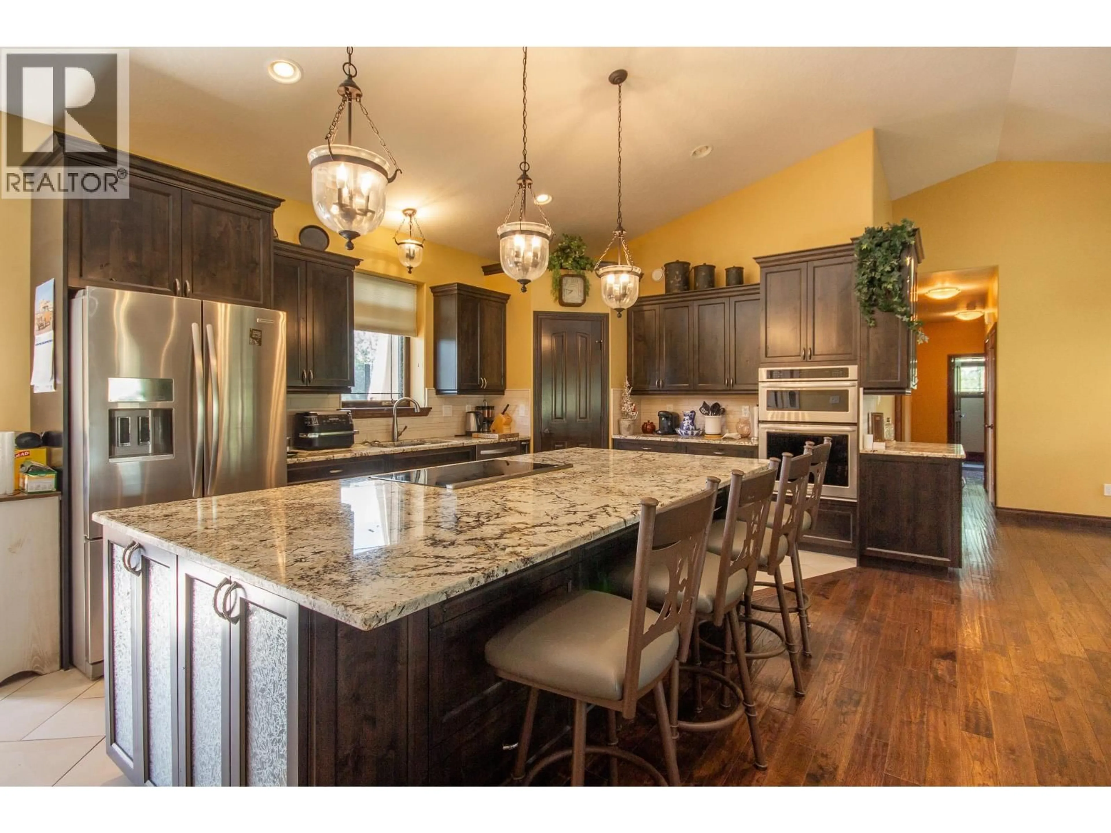 Open concept kitchen, wood/laminate floor for 2713 210 ROAD, Dawson Creek British Columbia V1G4H4