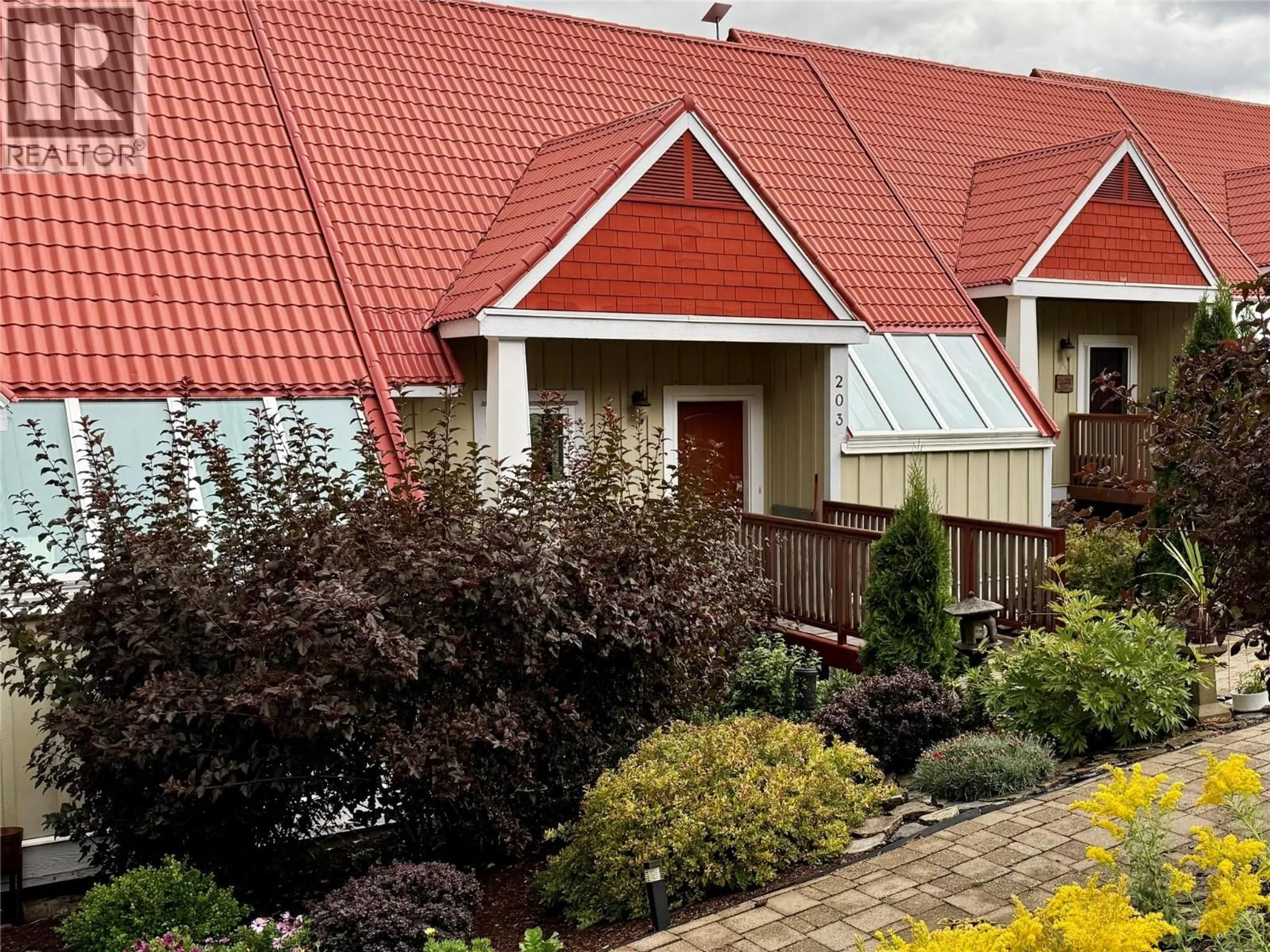 Home with vinyl exterior material, street for 203 - 500 OLD SPALLUMCHEEN ROAD, Sicamous British Columbia V0E2V3