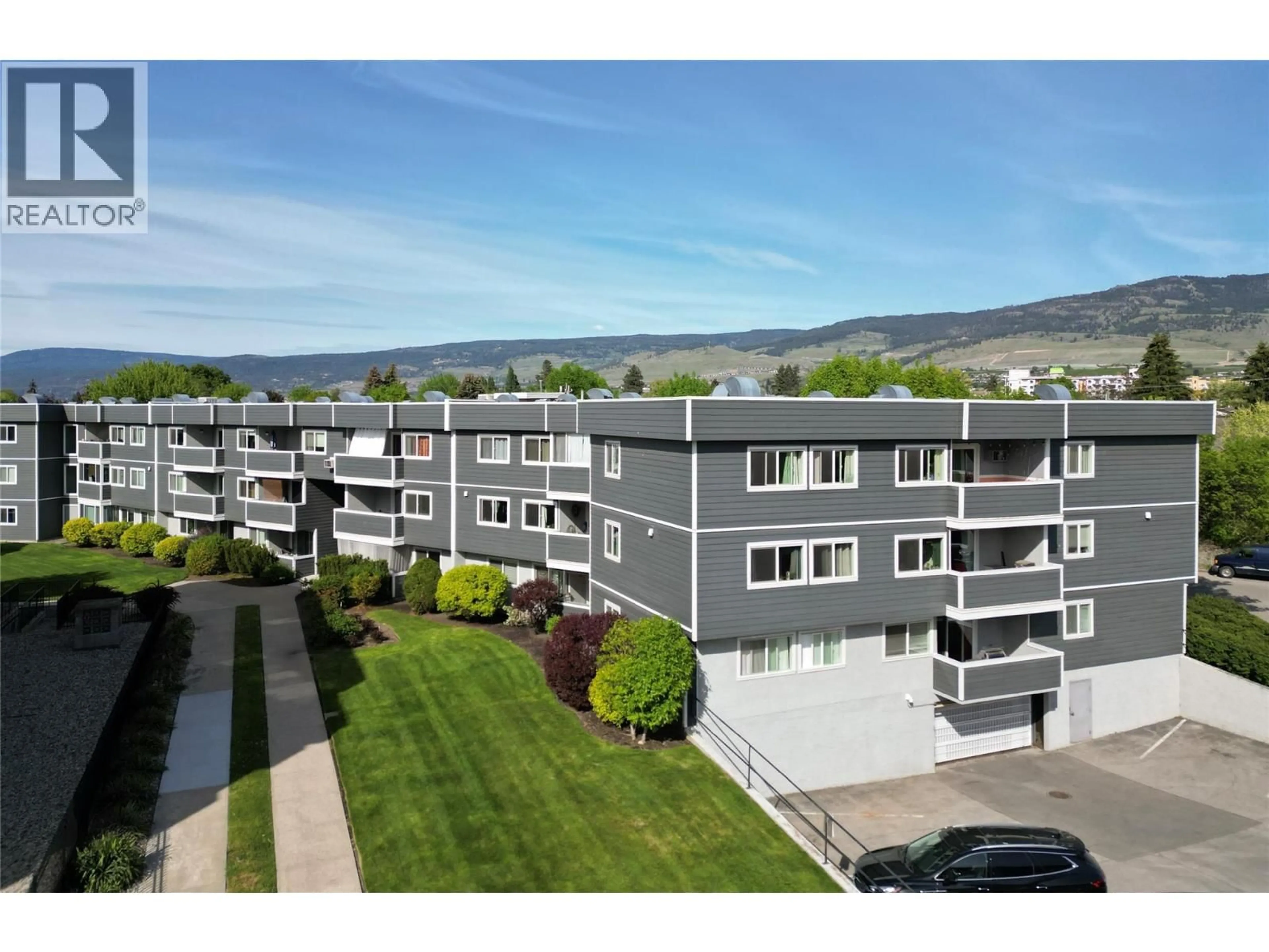 A pic from outside/outdoor area/front of a property/back of a property/a pic from drone, mountain view for 238 - 495 ALL STAR COURT, Kelowna British Columbia V1X5N7