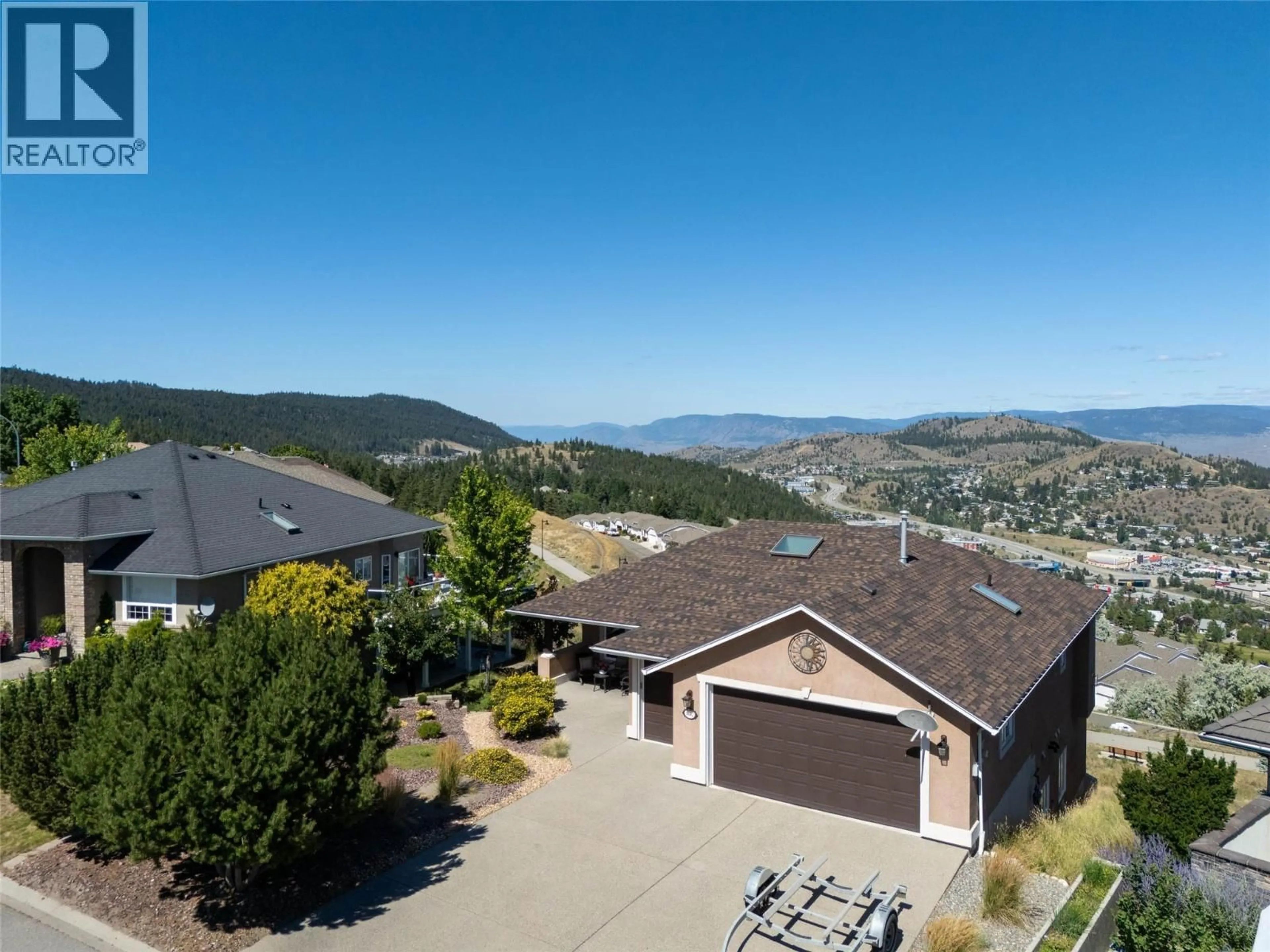 A pic from outside/outdoor area/front of a property/back of a property/a pic from drone, mountain view for 1182 ST ANDREWS WAY, Kamloops British Columbia V1S1S7