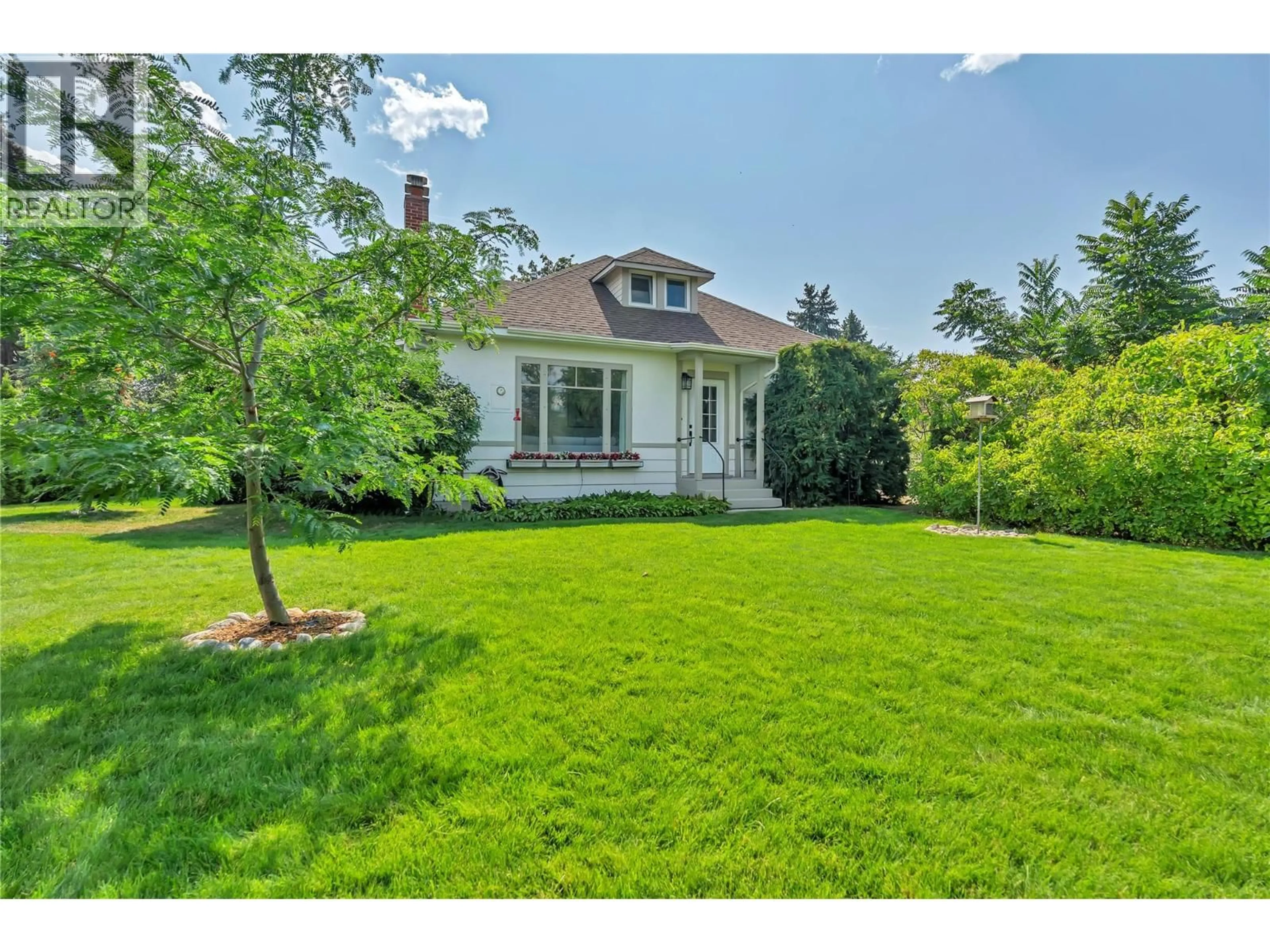 A pic from outside/outdoor area/front of a property/back of a property/a pic from drone, street for 12432 VICTORIA ROAD SOUTH, Summerland British Columbia V0H1Z0