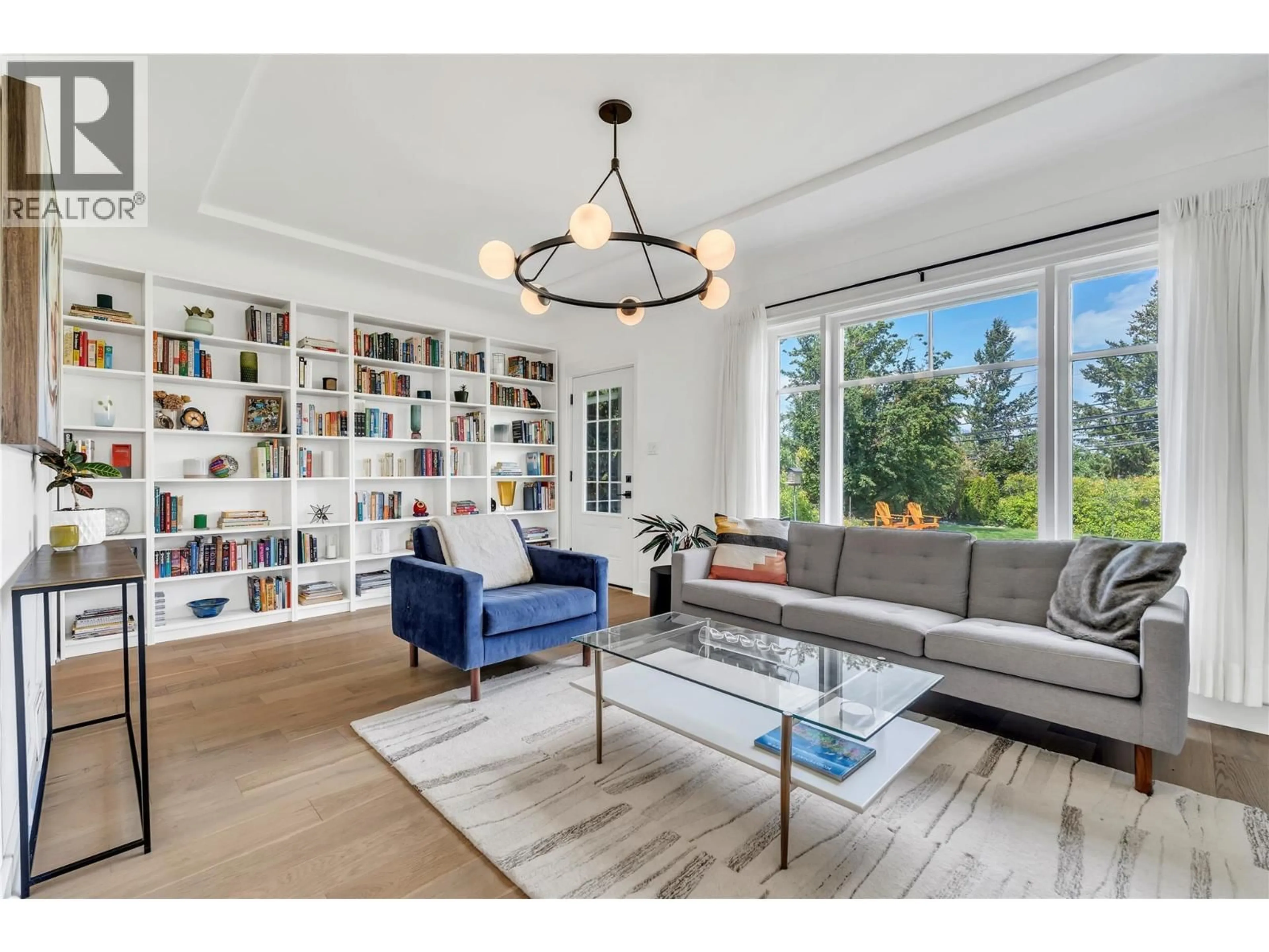 Living room with furniture, wood/laminate floor for 12432 VICTORIA ROAD SOUTH, Summerland British Columbia V0H1Z0