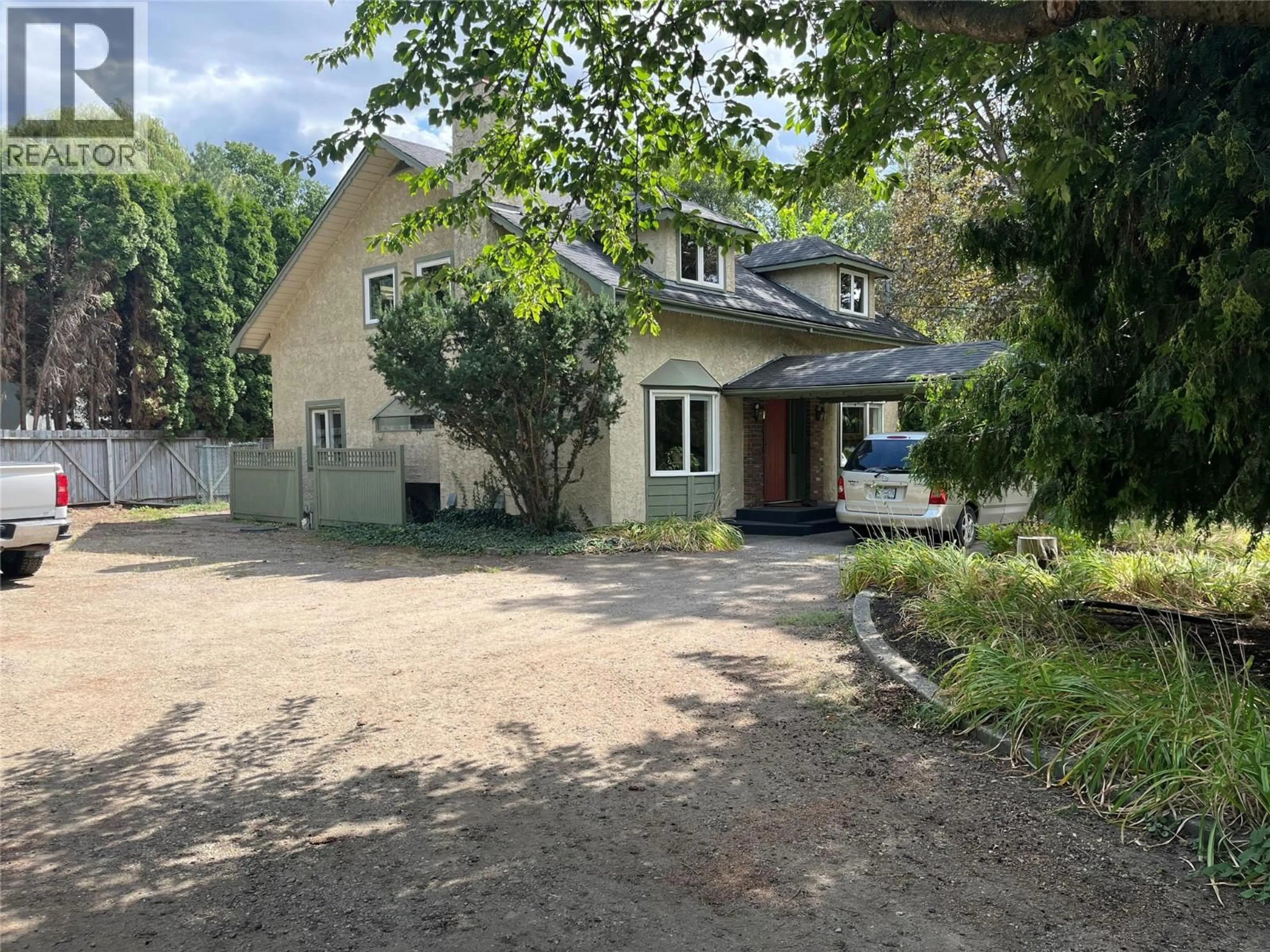 A pic from outside/outdoor area/front of a property/back of a property/a pic from drone, street for 8303 POSTILL DRIVE, Coldstream British Columbia V1B1T9